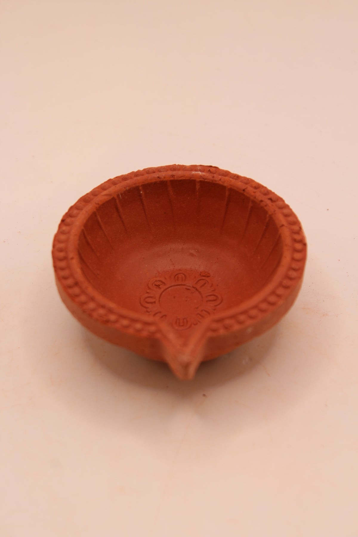 One Face Lined clay diya, right