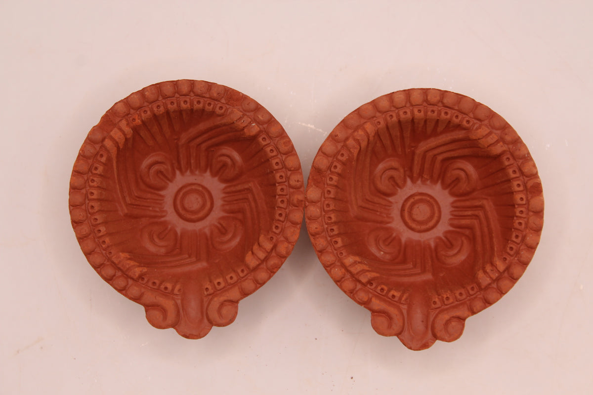 One Face Sathiya clay diya, above