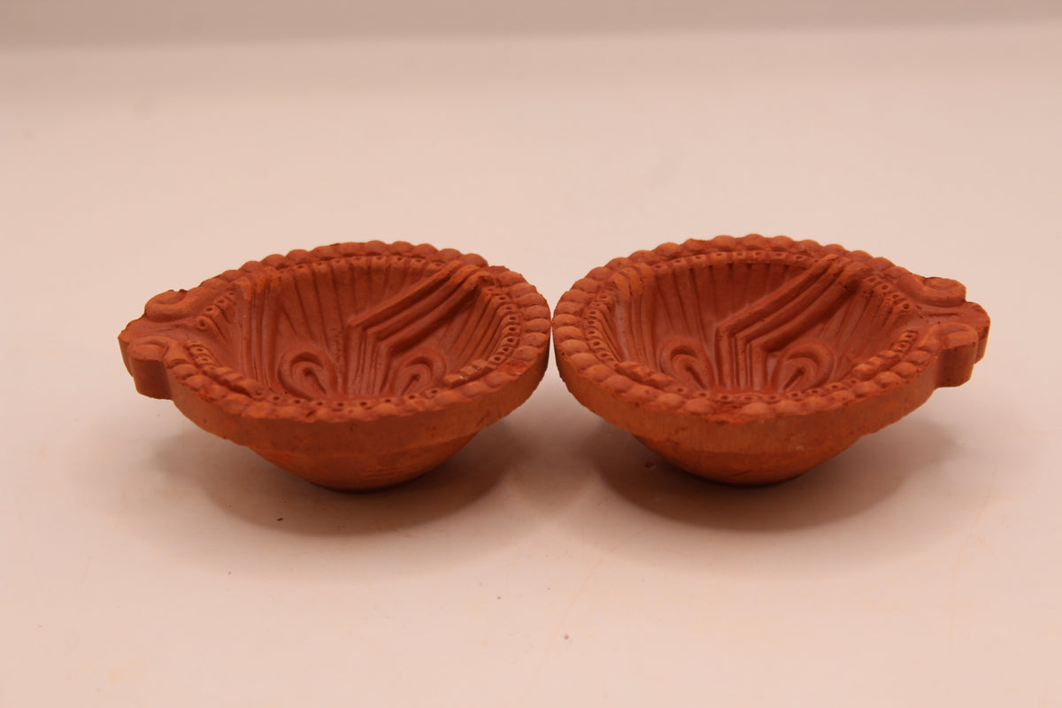 One Face Sathiya clay diya, left