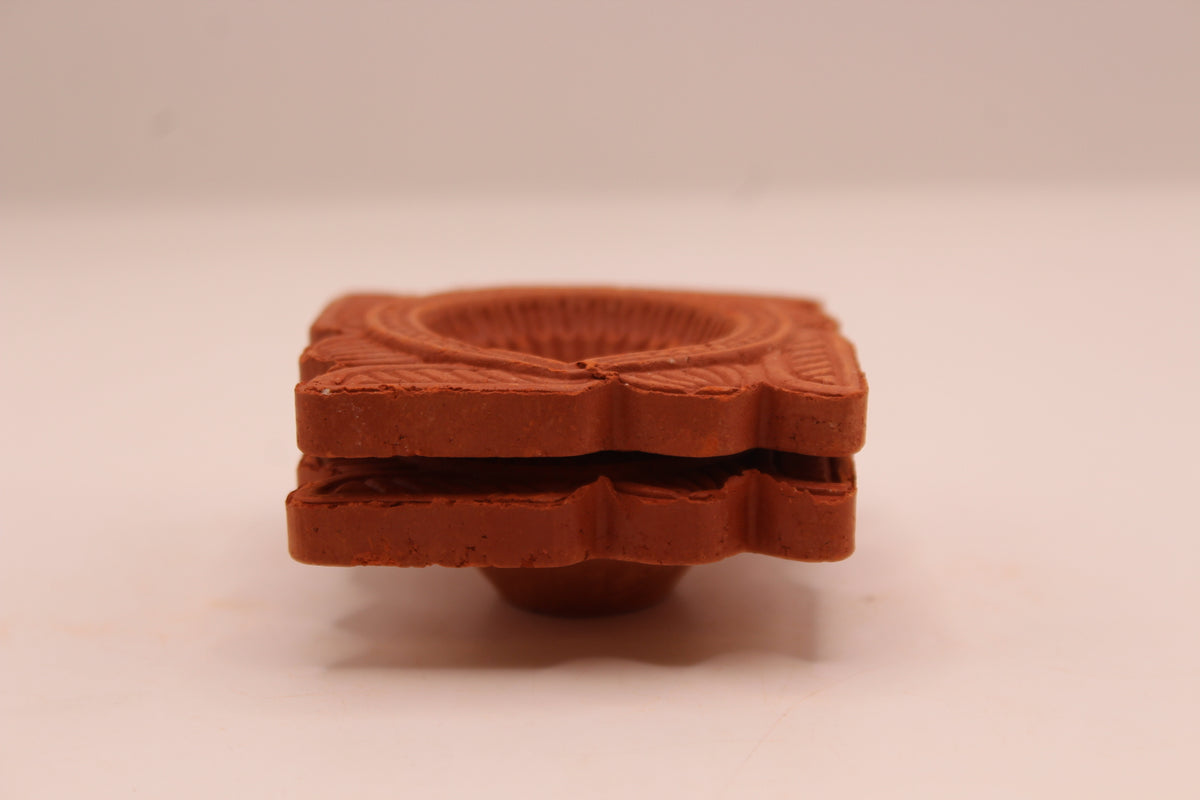 Sathiya Face Square clay diya, left