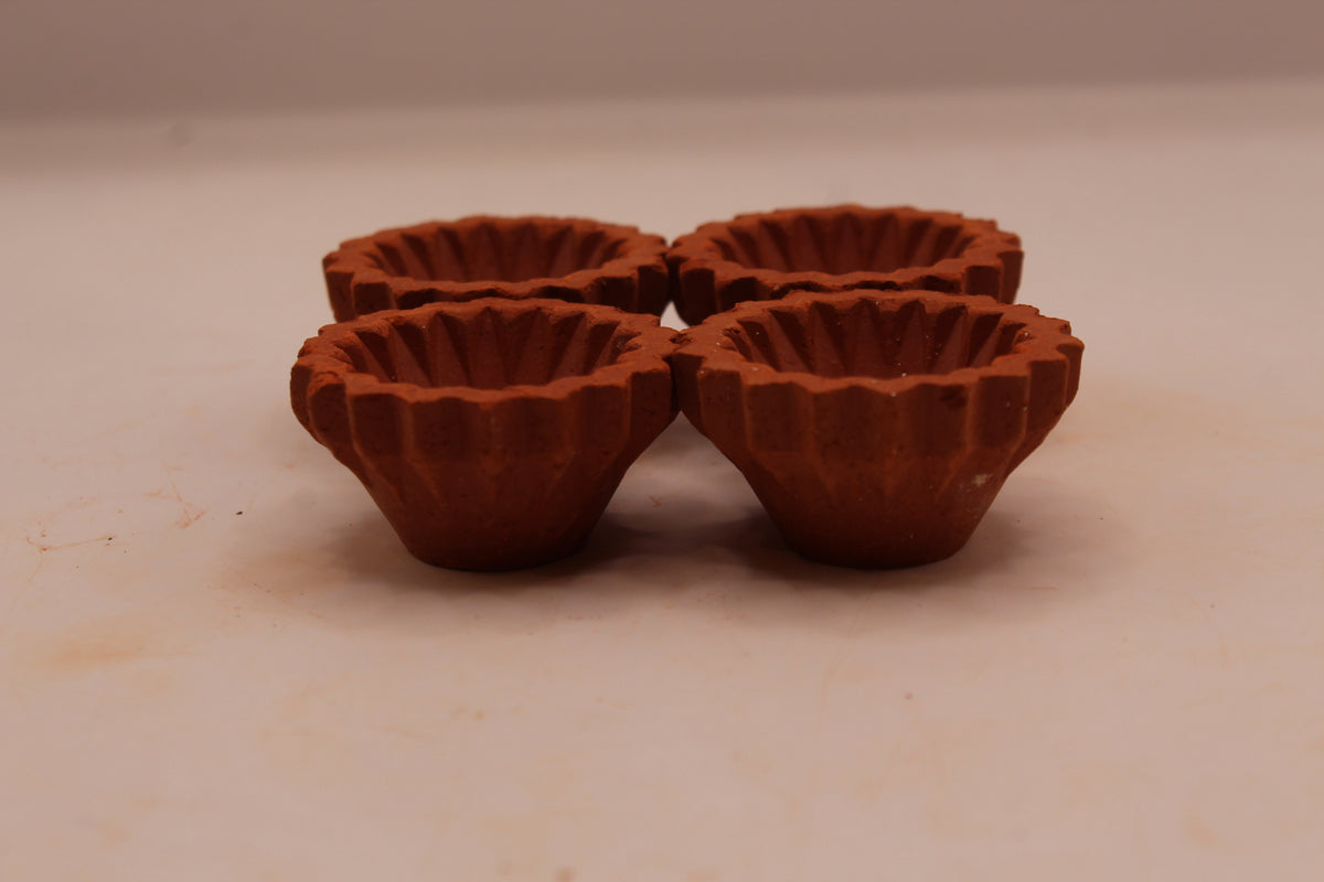 Zigzag Edge with Flower clay diya, left