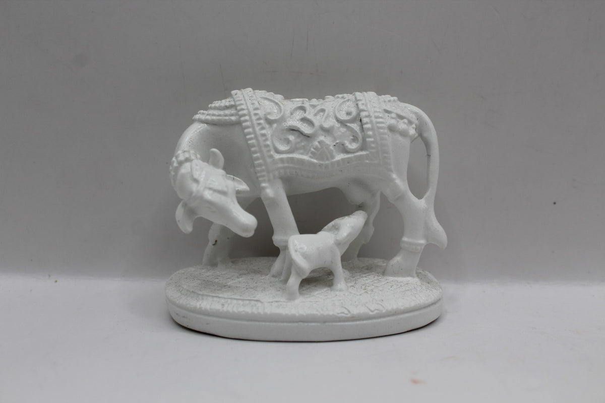 Small white resin cow and calf statue, front view