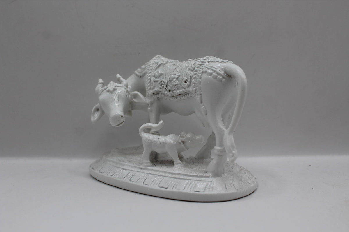 White resin cow and calf statue, right side view