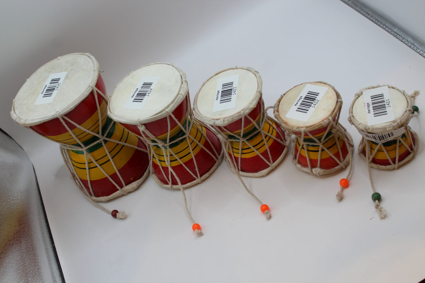 Five sizes of damaru hand drum shown together