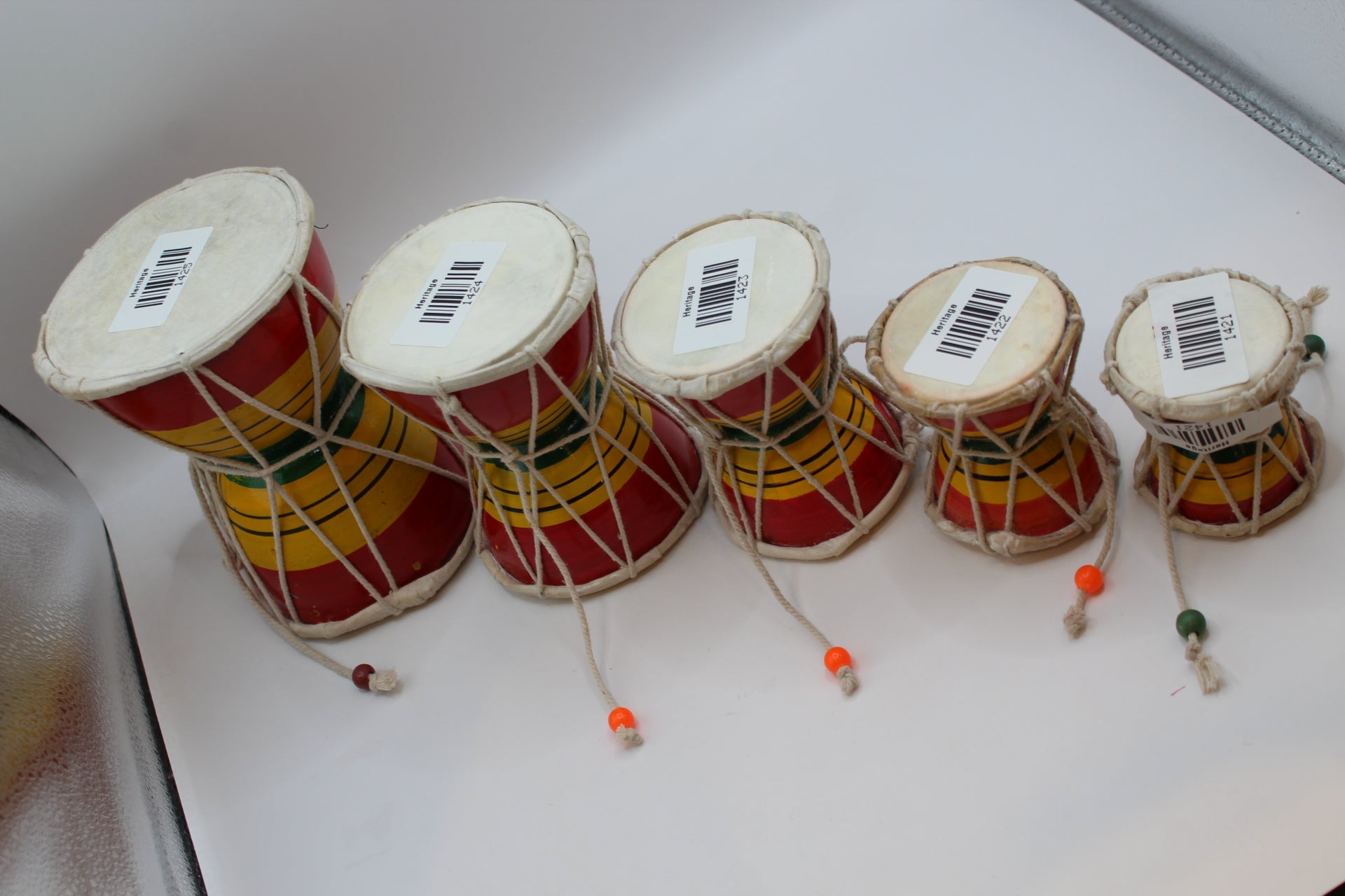 Five sizes of damaru hand drum shown together