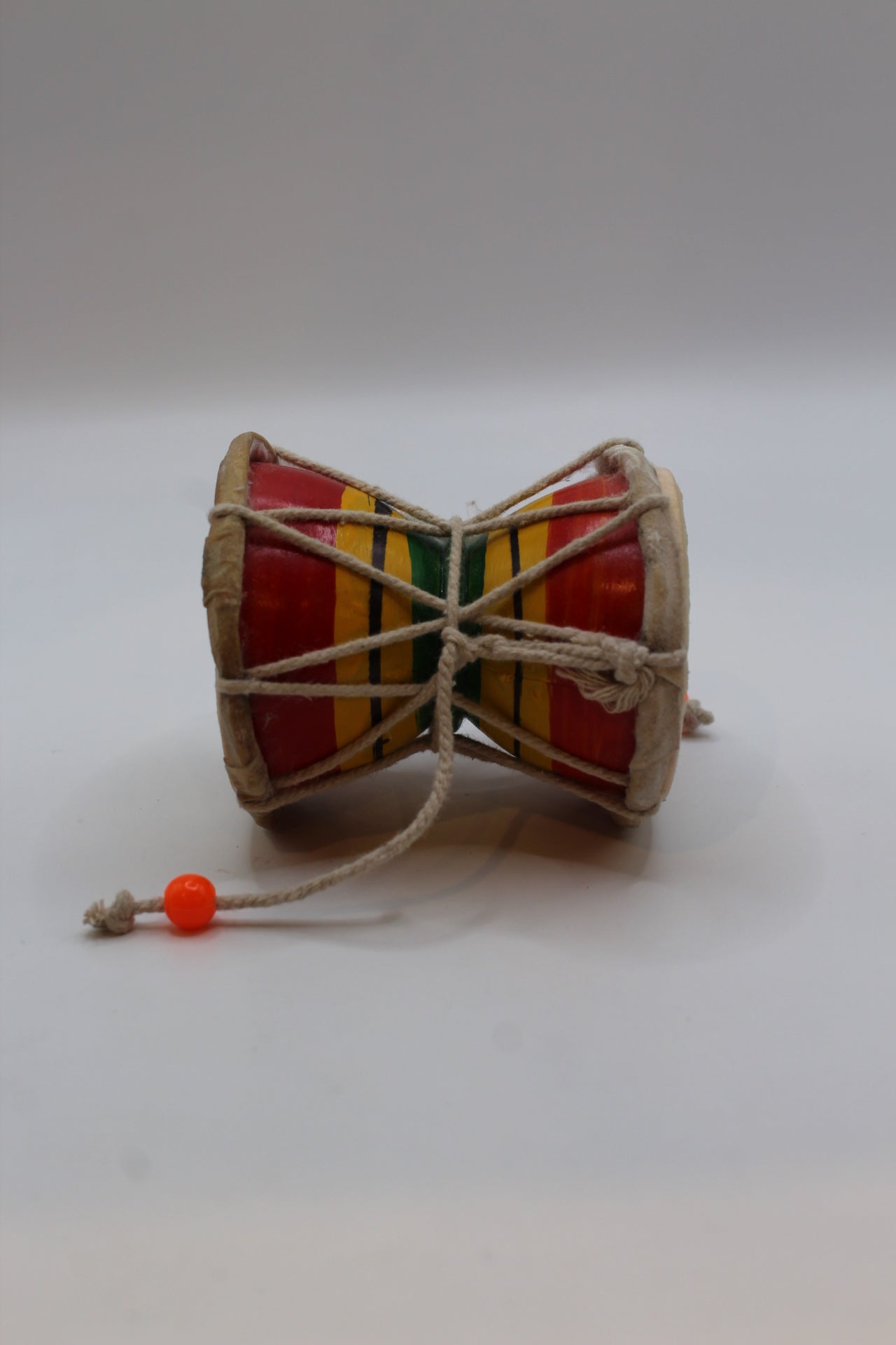 Small damaru 8 x 7 inch — side