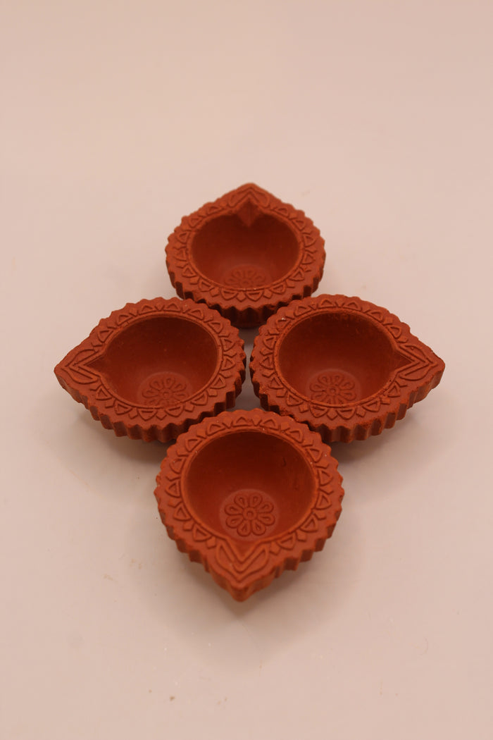 Festive fluted clay diyas