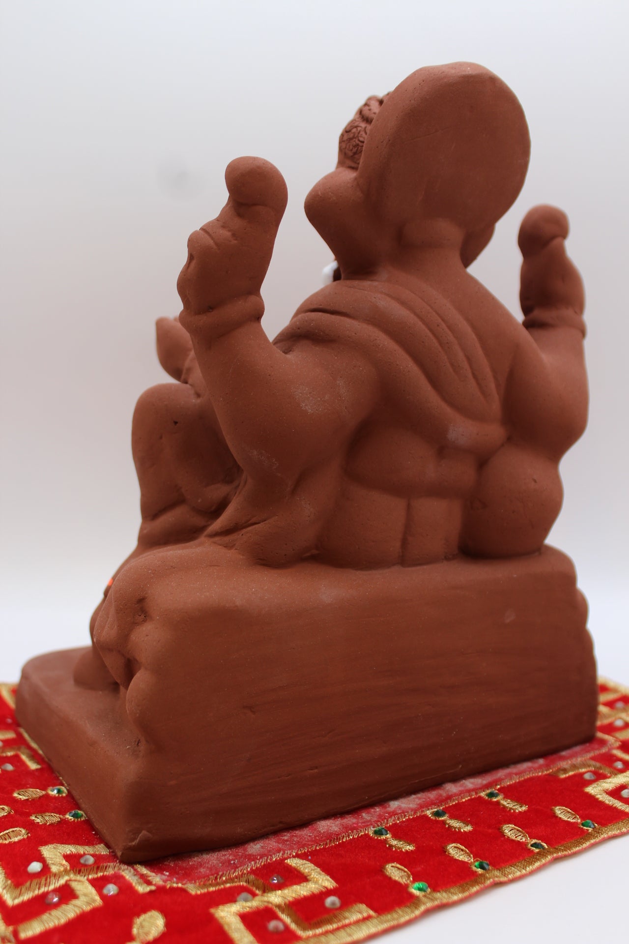 Natural terracotta eco-friendly 8 inch Ganesh Visarjan idol – back view