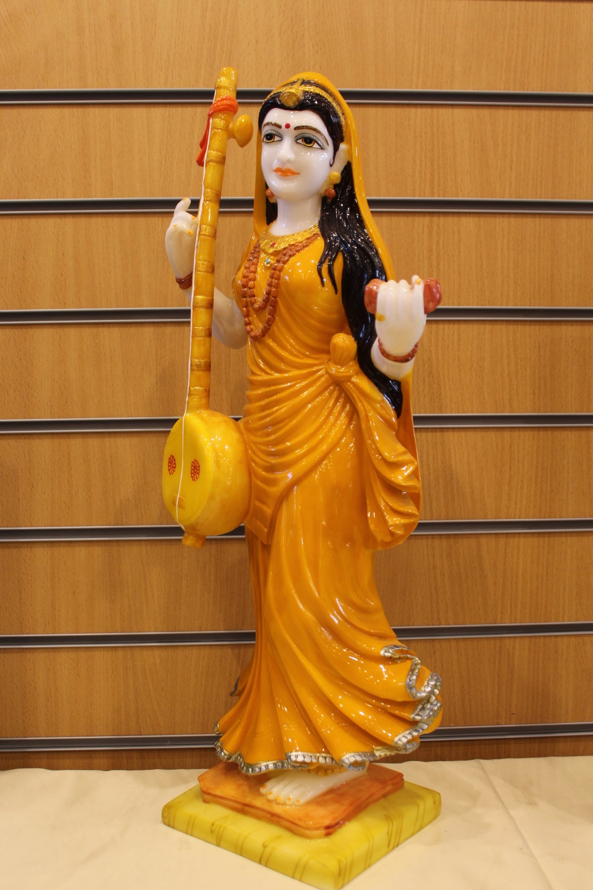 Resin/Fibre Mira Bai Statue – Standing with Tanpura, Orange Sari, 24 inch – right side view