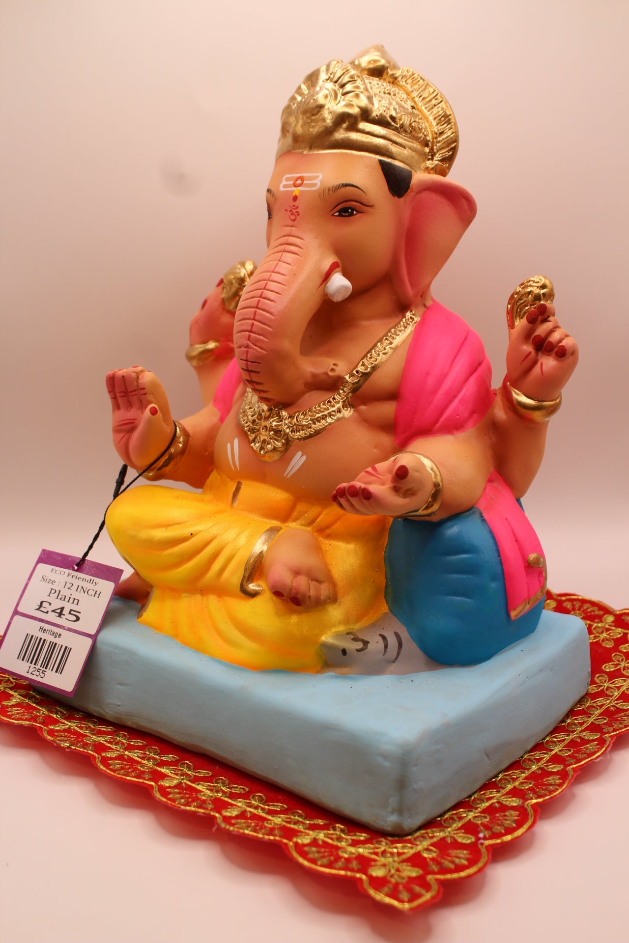 Eco-Friendly Ganesh Visarjan idol, Pink Khes & Yellow Dhoti, Blue Bolster, close-up
