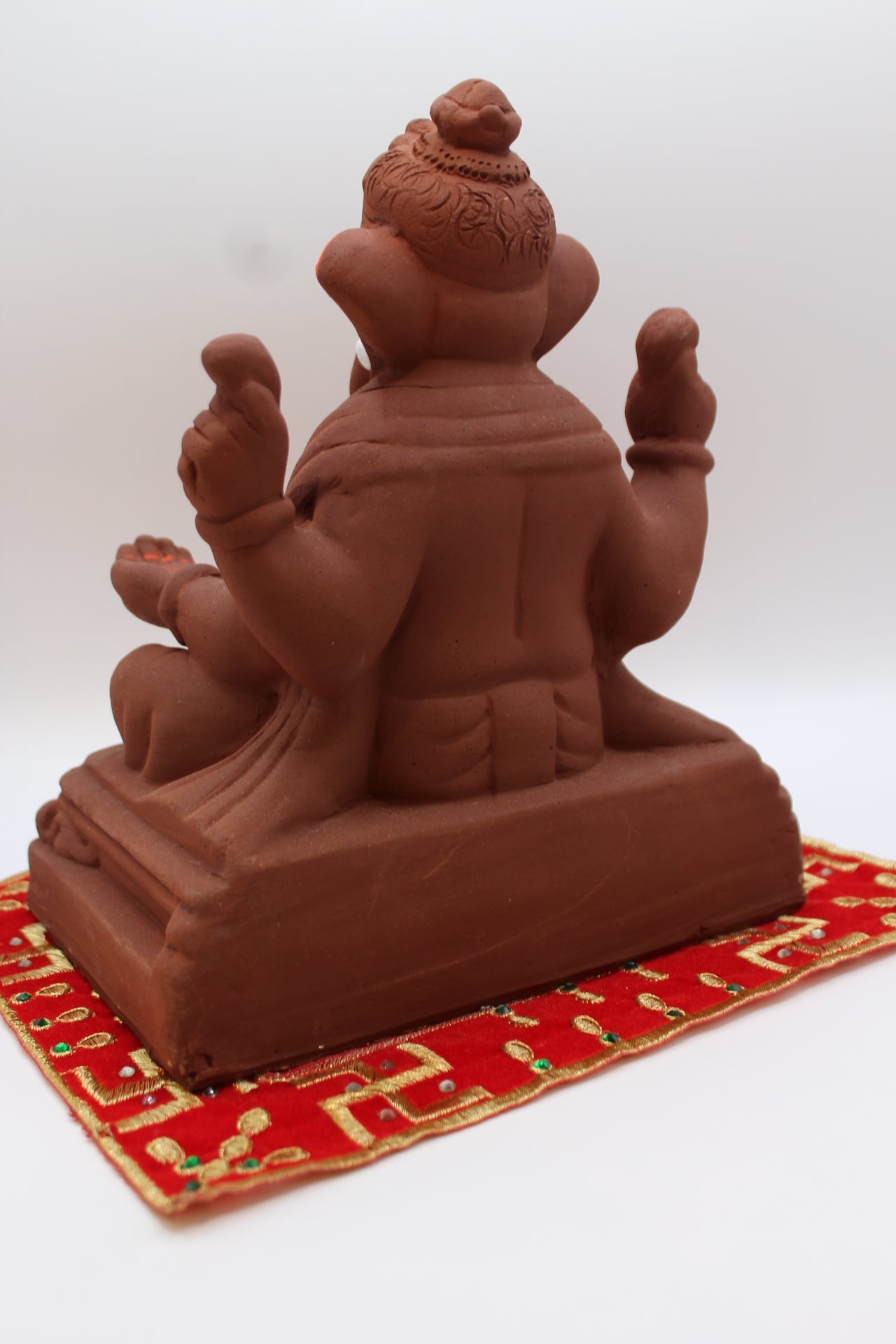 Natural terracotta eco-friendly 8 inch Ganesh Visarjan idol on pedestal base – back view