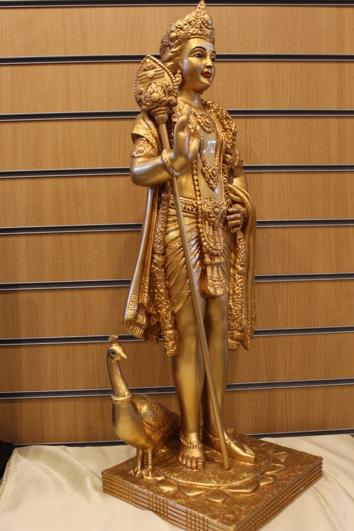 Resin/Fibre Murugan Statue for Home Temple – Standing with Vel and Peacock, 29 inch – Gold – left side view
