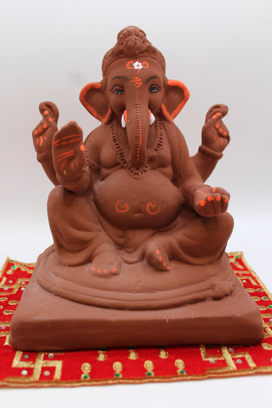 Natural terracotta eco-friendly 8 inch Ganesh Visarjan idol with bun topknot – front view