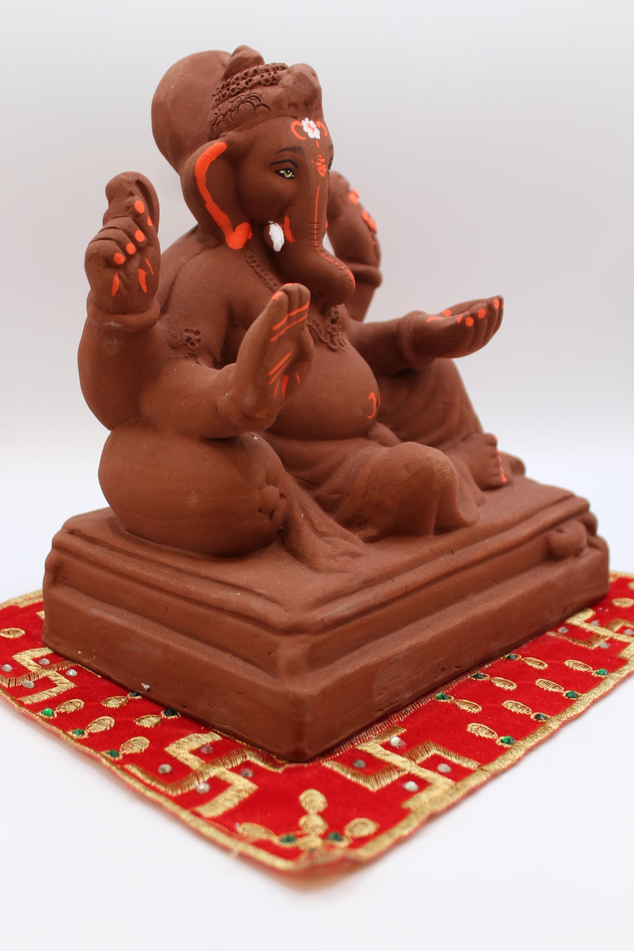 Natural terracotta eco-friendly 8 inch Ganesh Visarjan idol in relaxed pose – side view