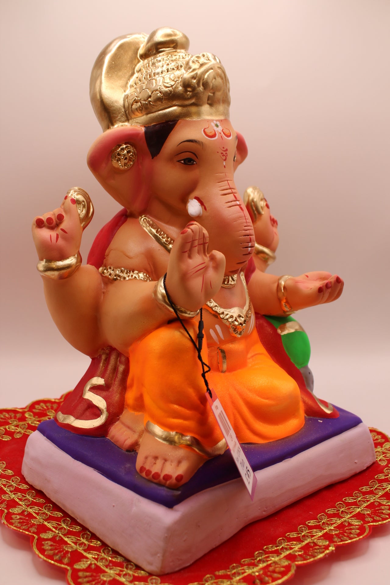 Eco-Friendly Ganesh Visarjan idol, Crimson Khes & Orange Dhoti, Gold Ear Medallions, front view 2