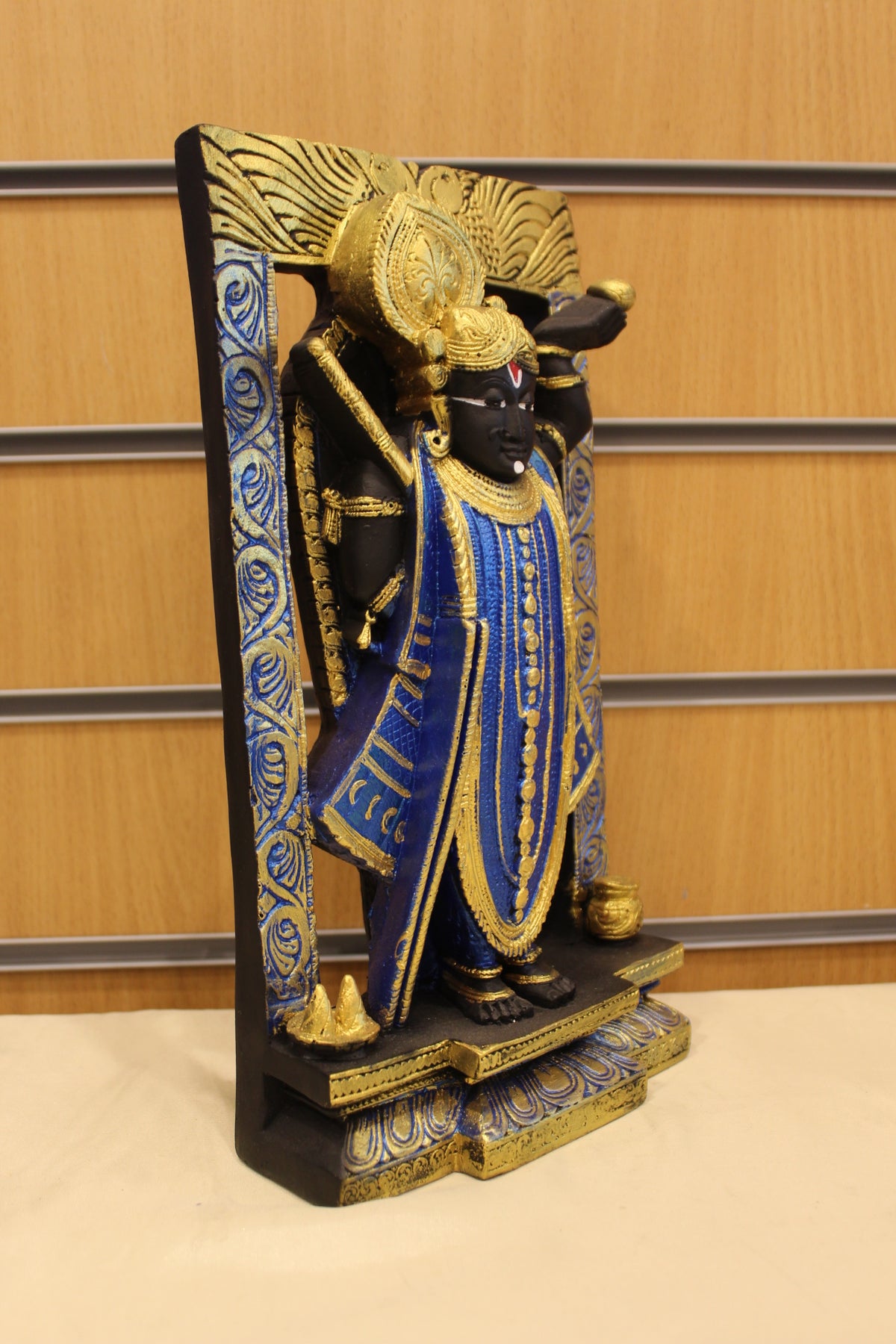 Resin/Fibre Shreenathji Statue for Home Temple – In Carved Frame, 11.5 inch – Black & Blue – left side view