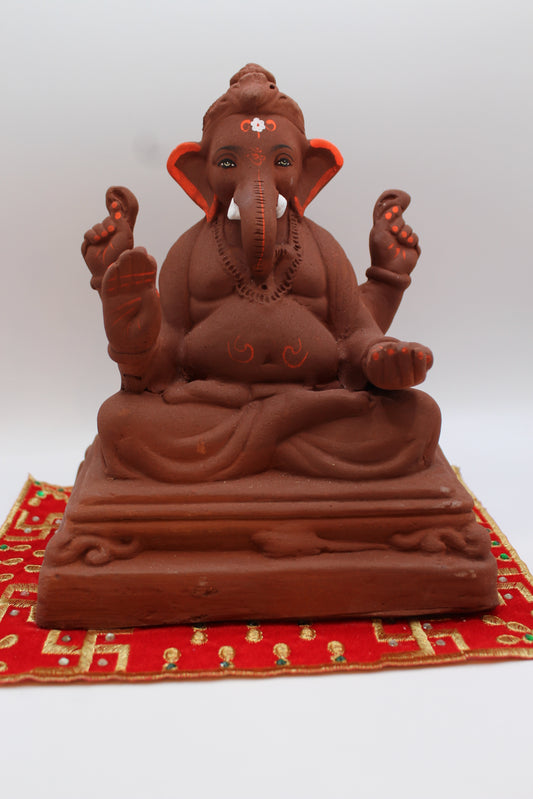 Natural terracotta eco-friendly 8 inch Ganesh Visarjan idol on pedestal base – front view
