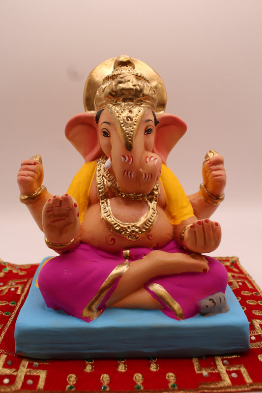 Eco-friendly 8 inch Ganesh Visarjan idol in yellow shawl and magenta dhoti with halo crown – front view