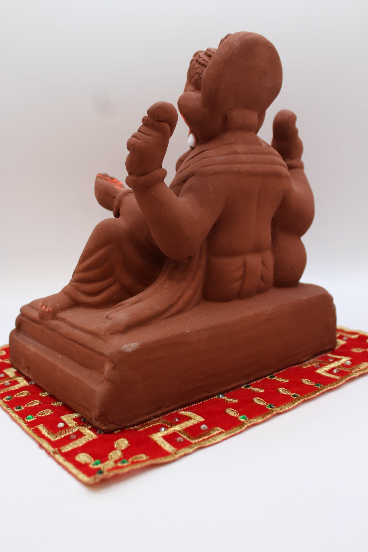 Natural terracotta eco-friendly 8 inch Ganesh Visarjan idol in relaxed pose – back view