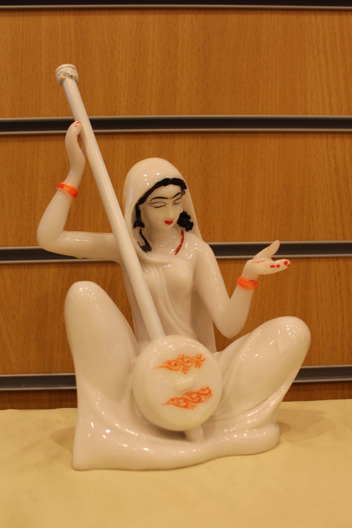 Resin/Fibre Mira Bai Statue – Seated with Tanpura, White – 10 inch – Swirl Design – front view
