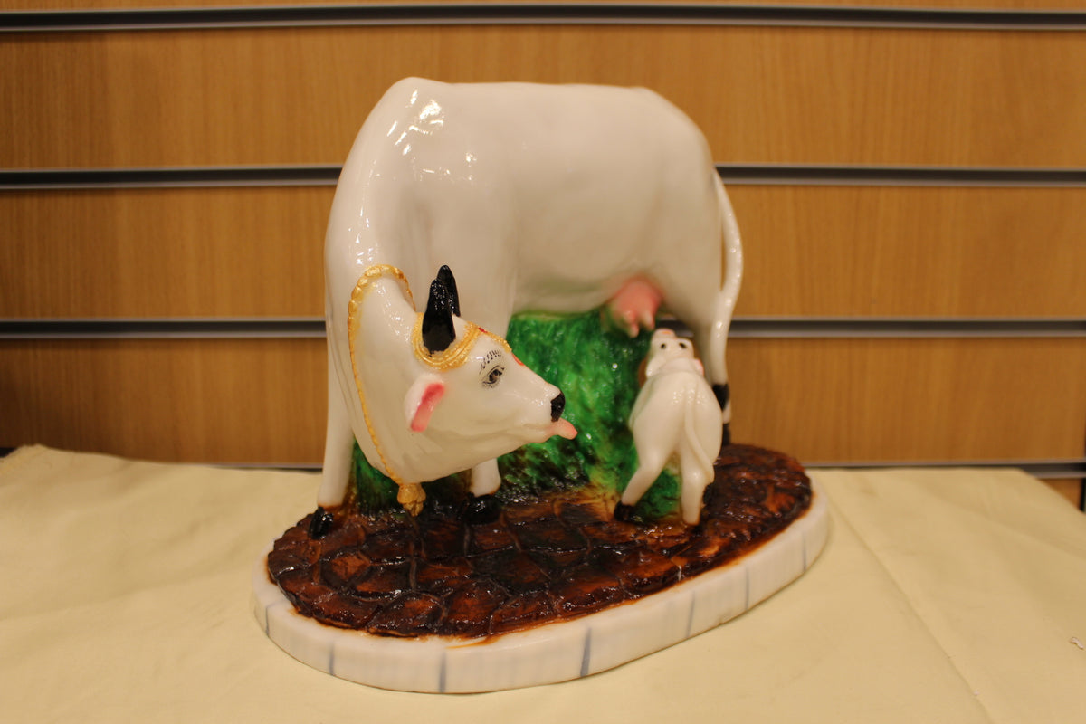 Resin/Fibre Kamdhenu Cow and Calf Statue – White on Grass Base, 10 inch – left side view