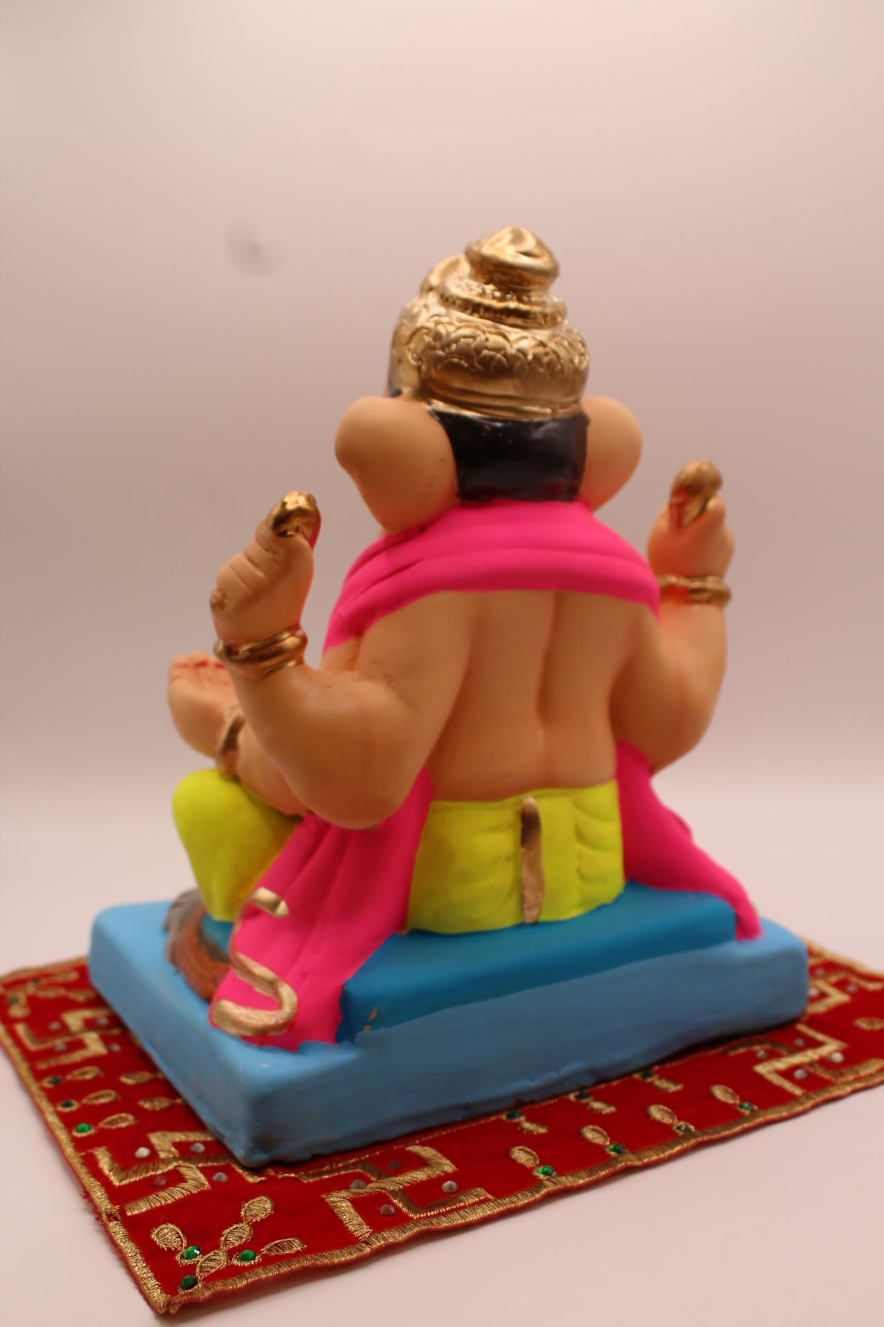 Eco-friendly 8 inch Ganesh Visarjan idol in pink shawl and lime dhoti – back view
