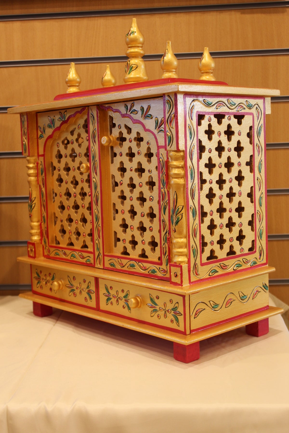 Jaipuri Mandir with Doors in golden yellow & red, angled side view from the other side