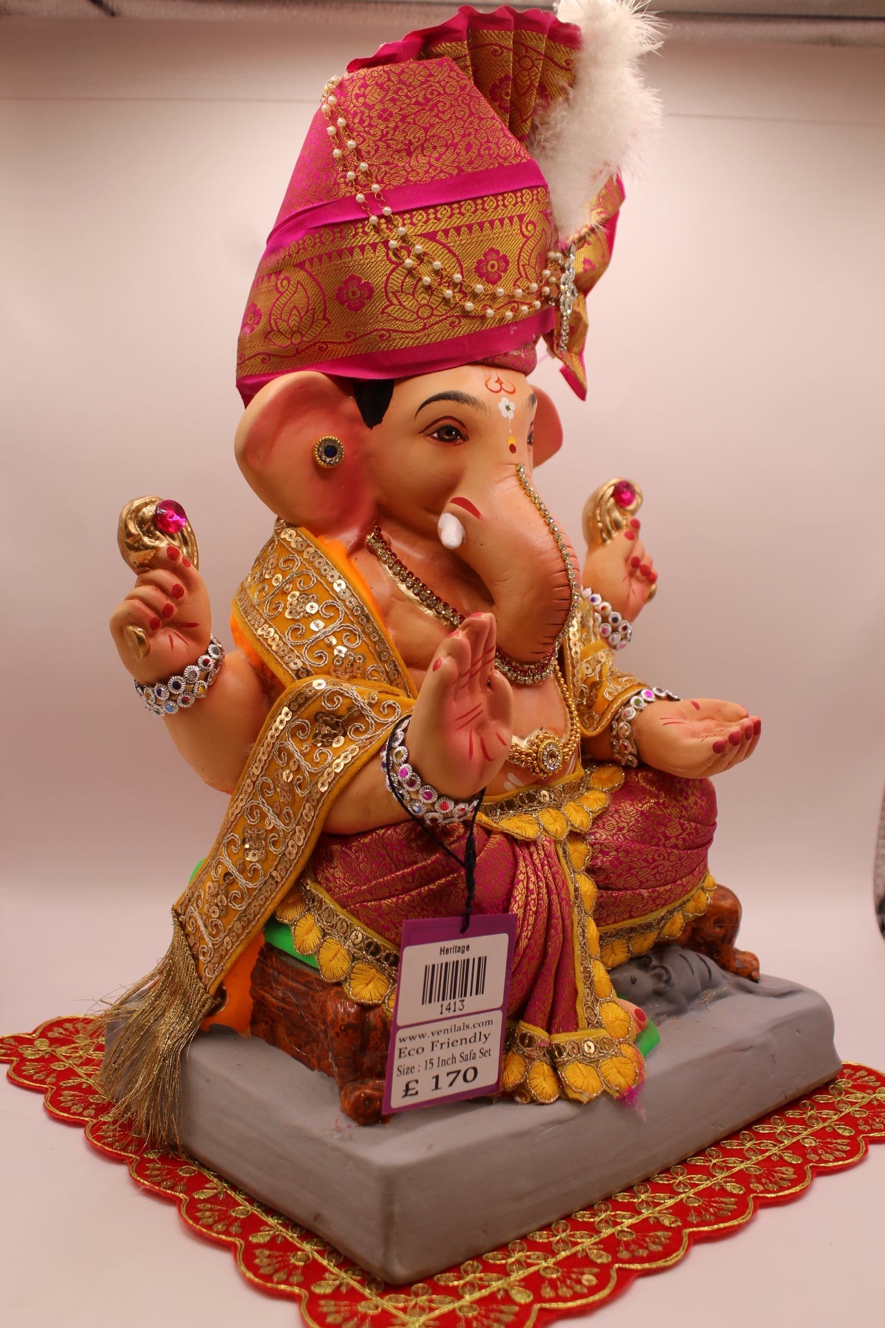 Side view – rani pink safa with gold shawl and maroon dhoti