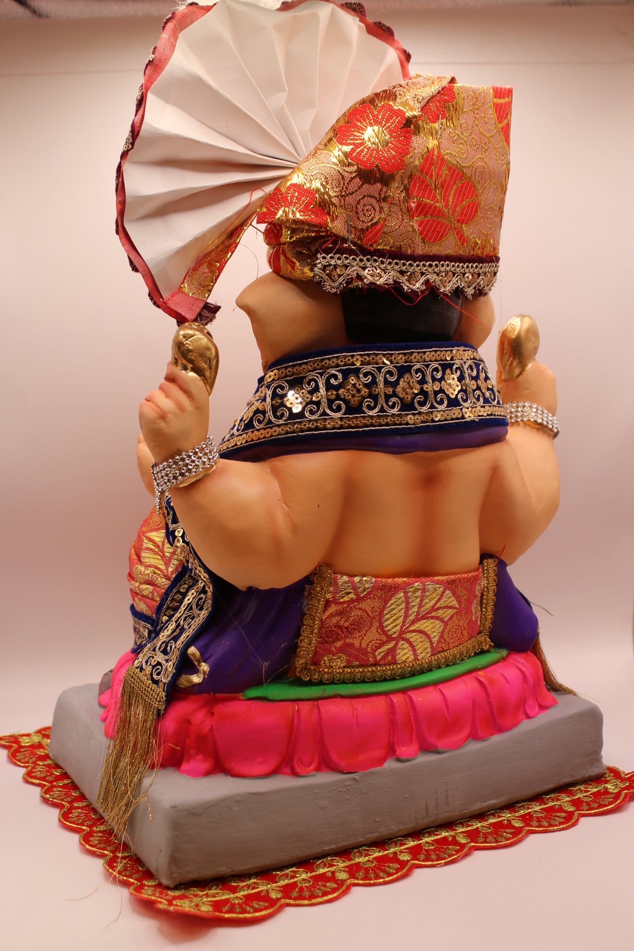 Back view – coral floral safa with navy sequin shawl on pink lotus mat