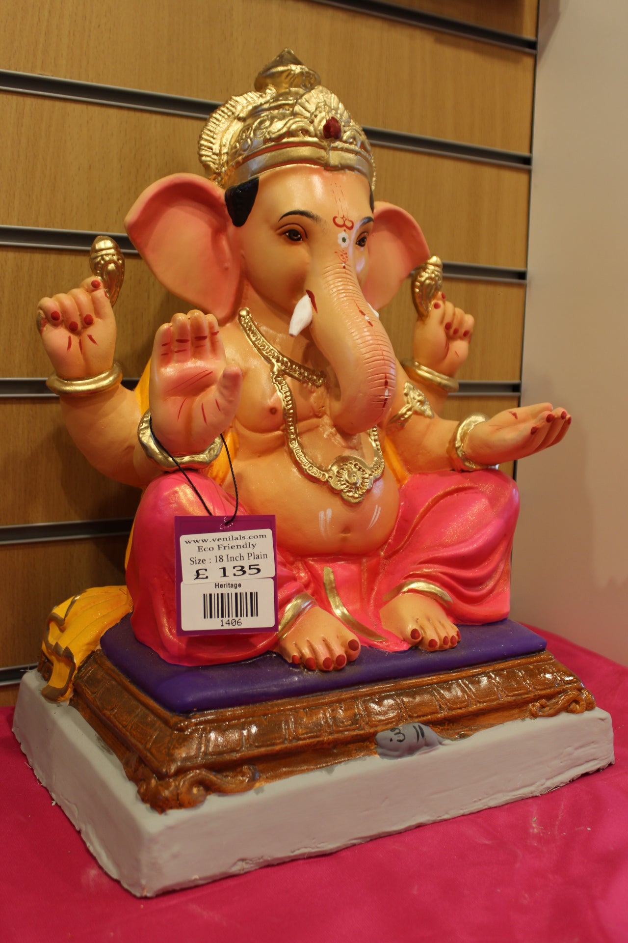 Side view – saffron khes and rani pink dhoti on carved chowki