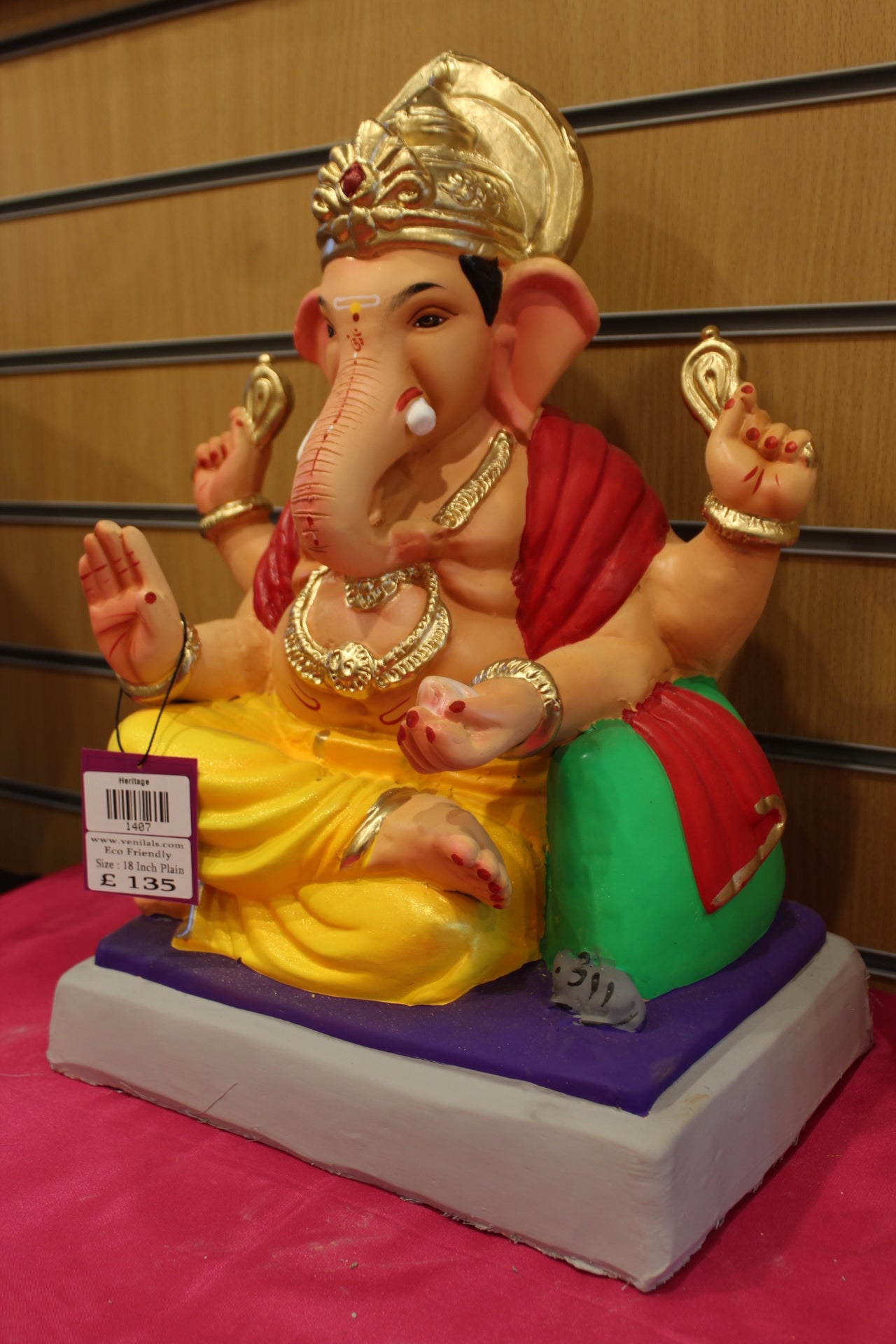 Angled view – red khes and yellow dhoti with green bolster