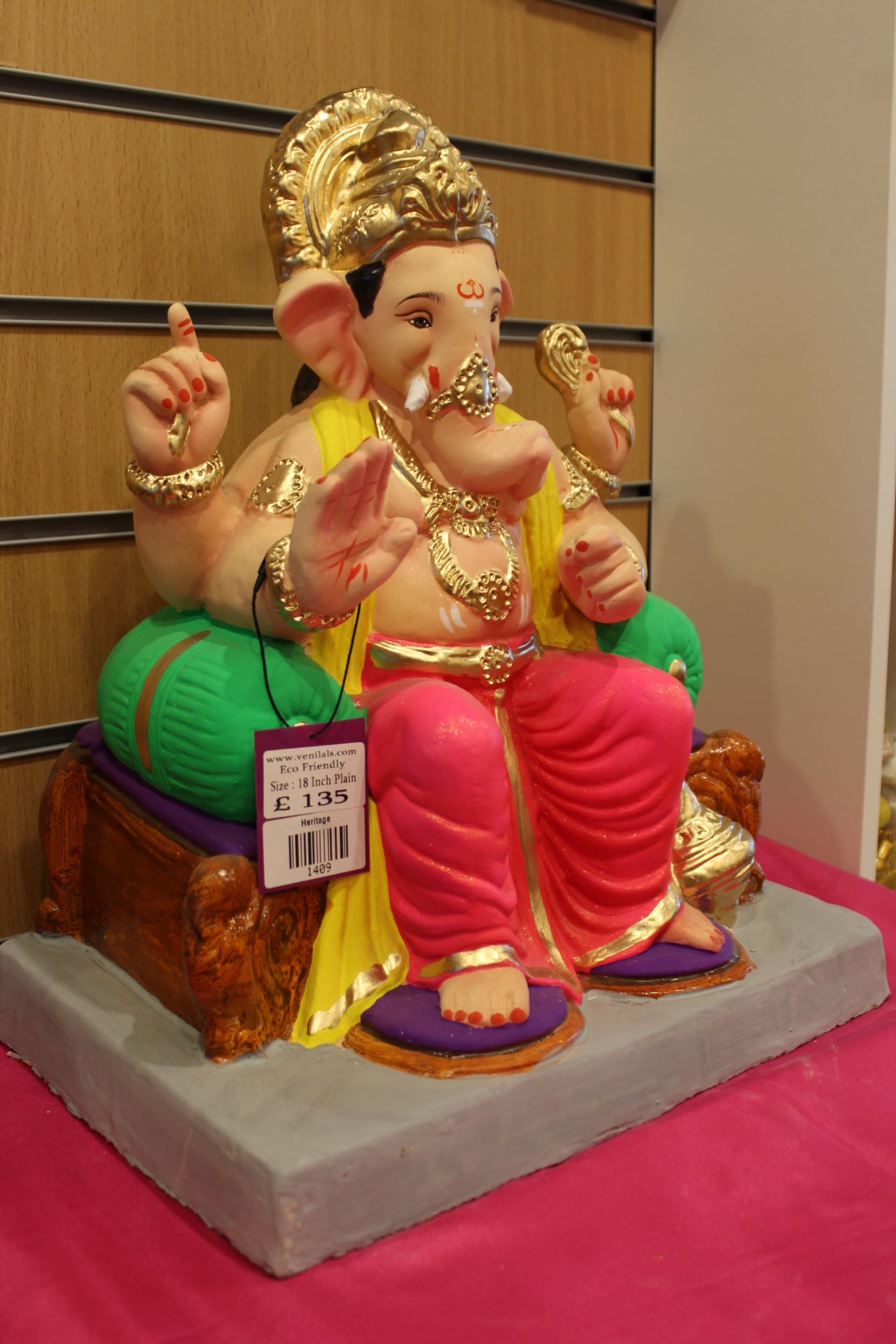 Side view – yellow khes and rani pink dhoti on scroll-legged chowki