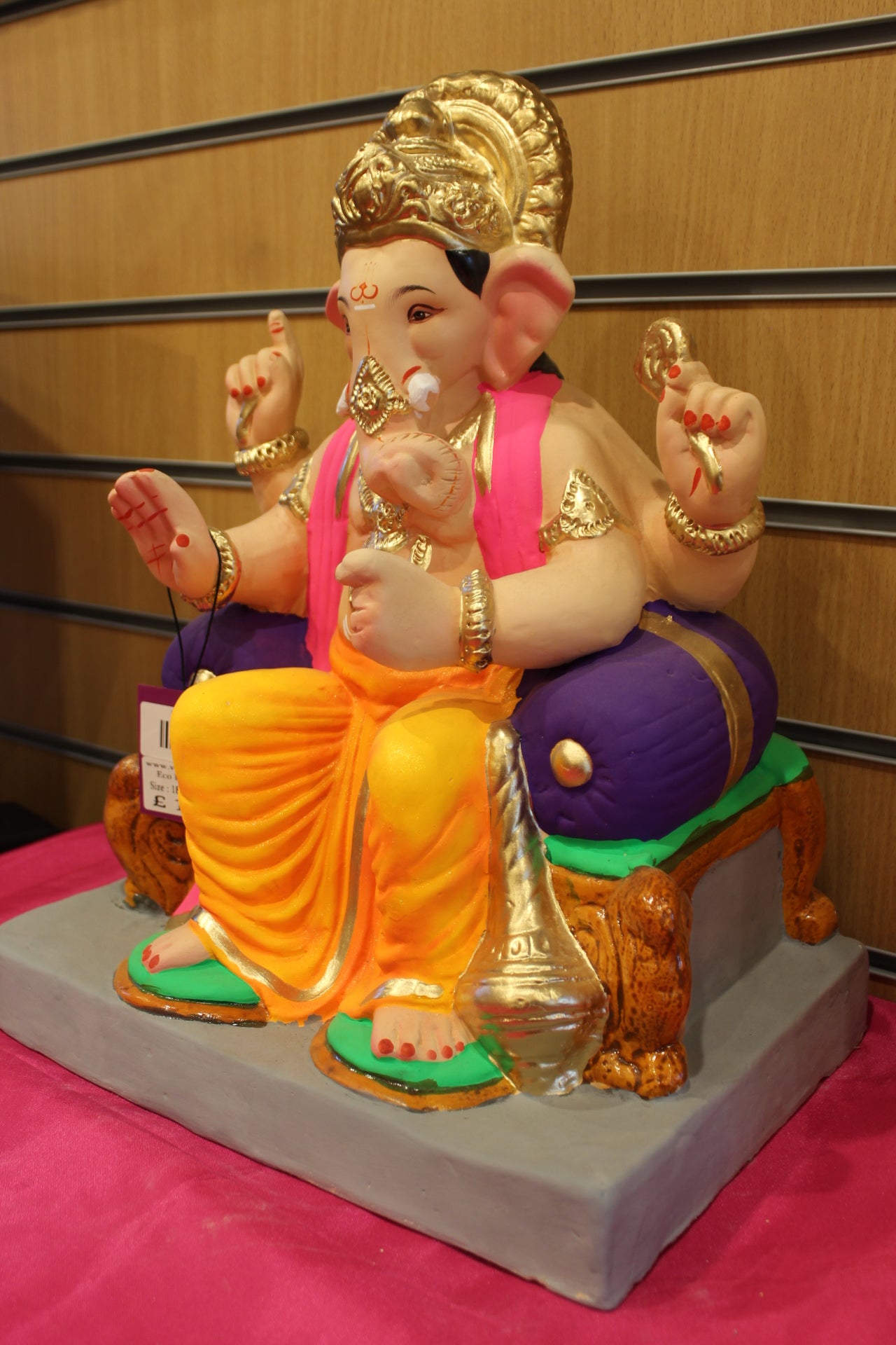 Angled view – pink khes and orange dhoti with purple bolster
