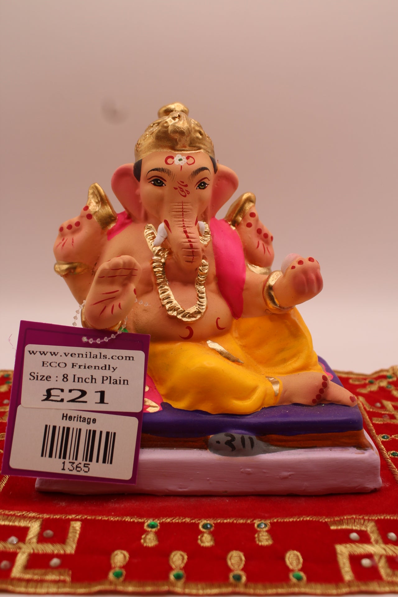 6 inch eco-friendly Ganesh idol on a violet mattress, front
