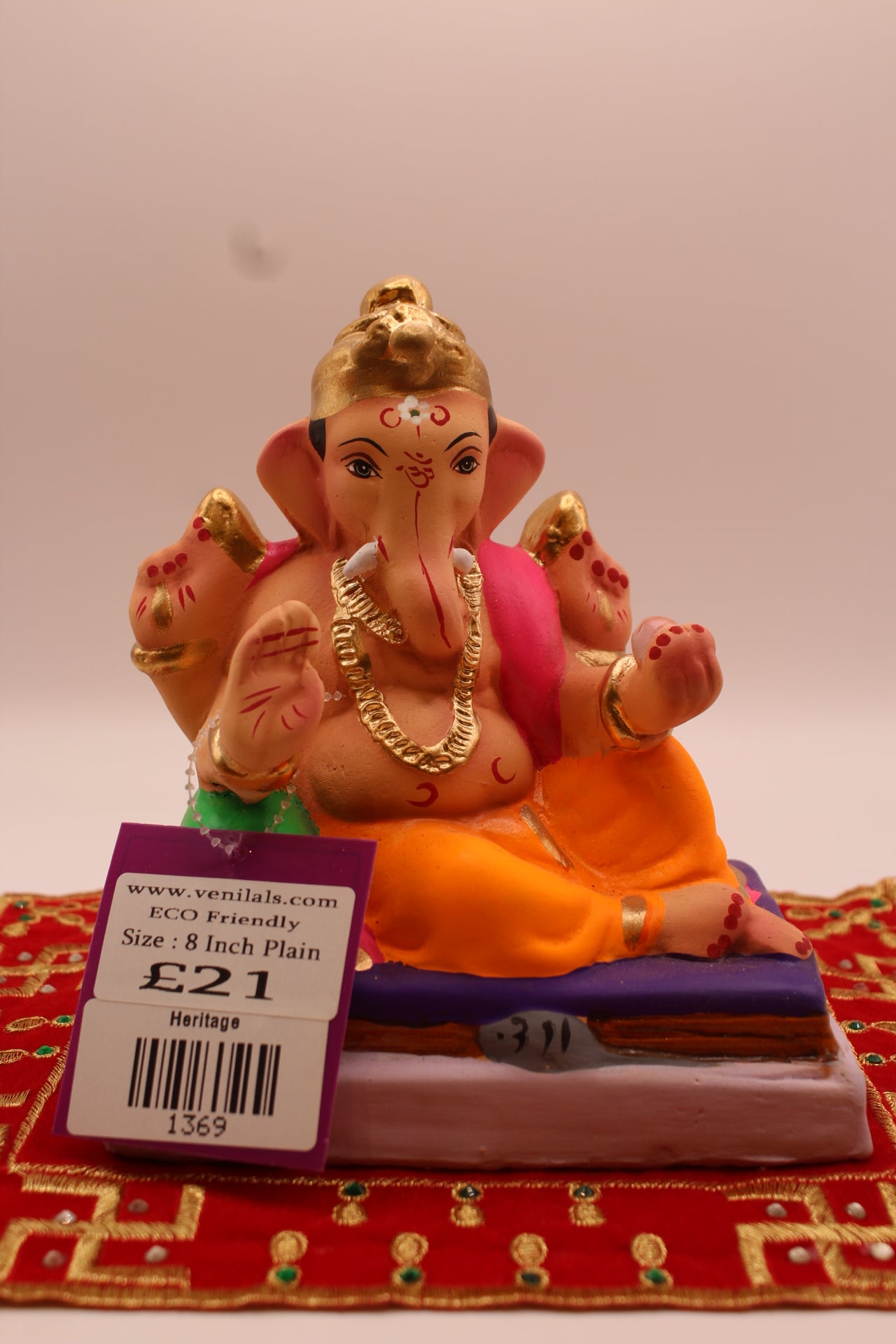 6 inch eco-friendly Ganesh idol, saffron dhoti and rani pink khes, front