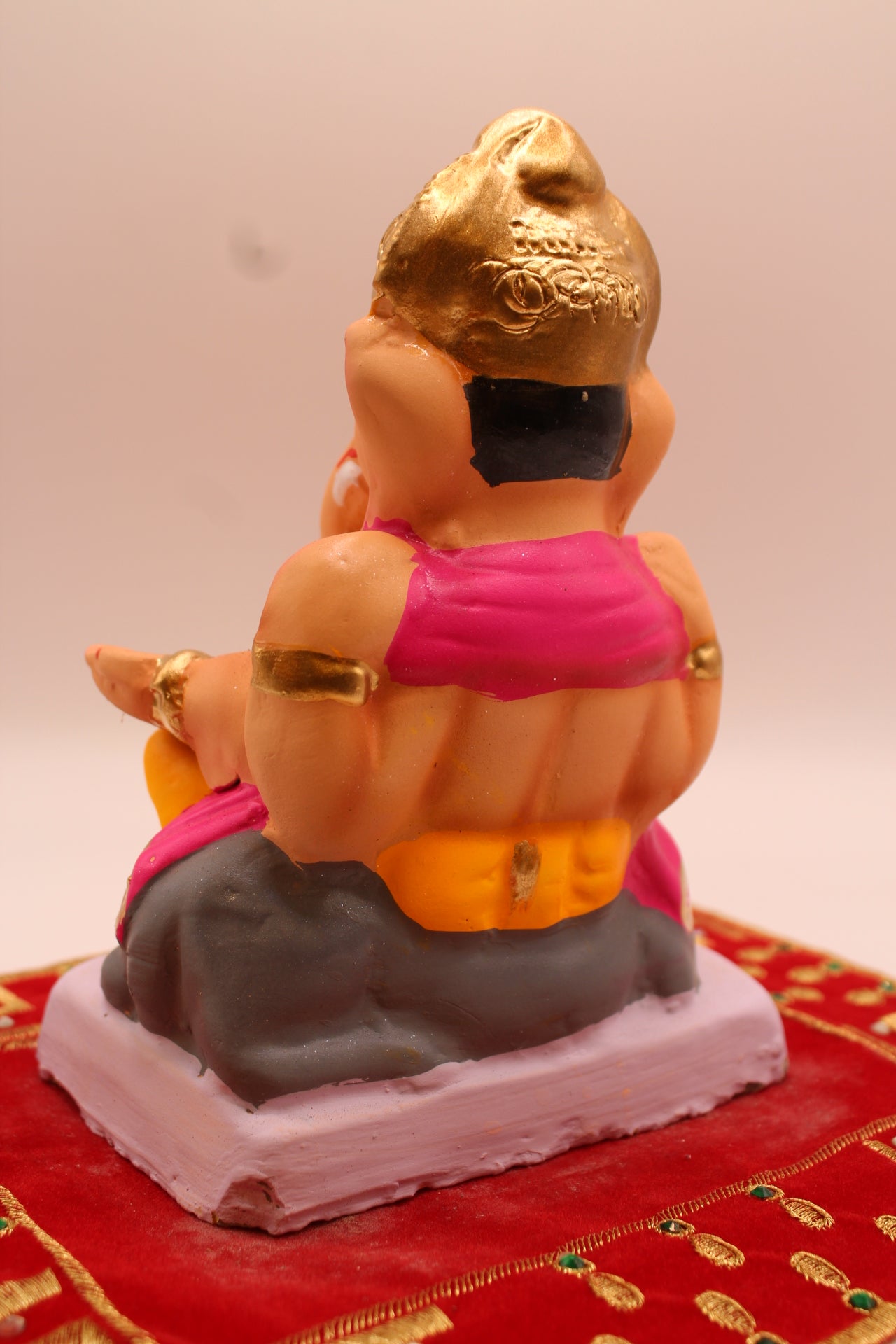 Back view showing the pleated pink fans
