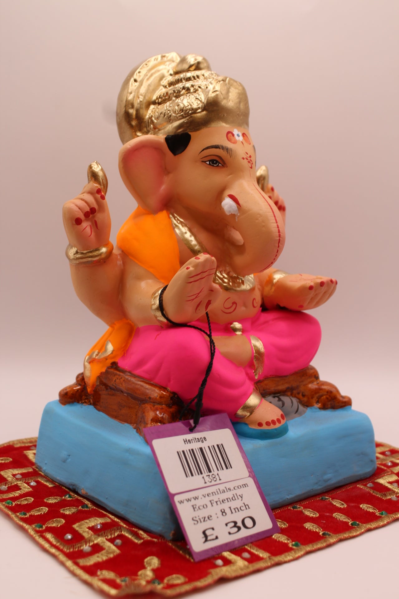 Side view – orange khes and rani pink dhoti with blue footrest