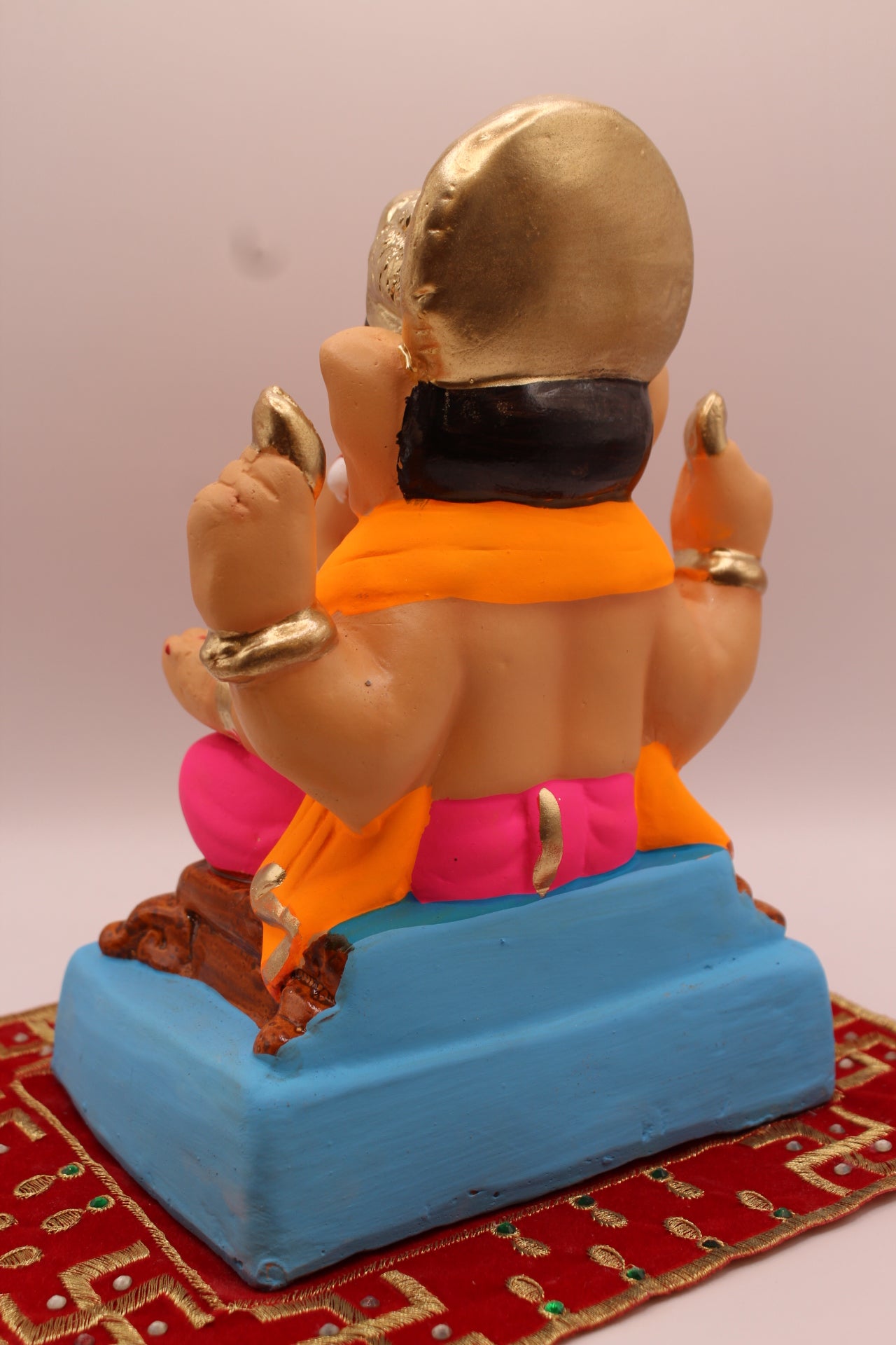 Back view – orange khes and rani pink dhoti with blue footrest