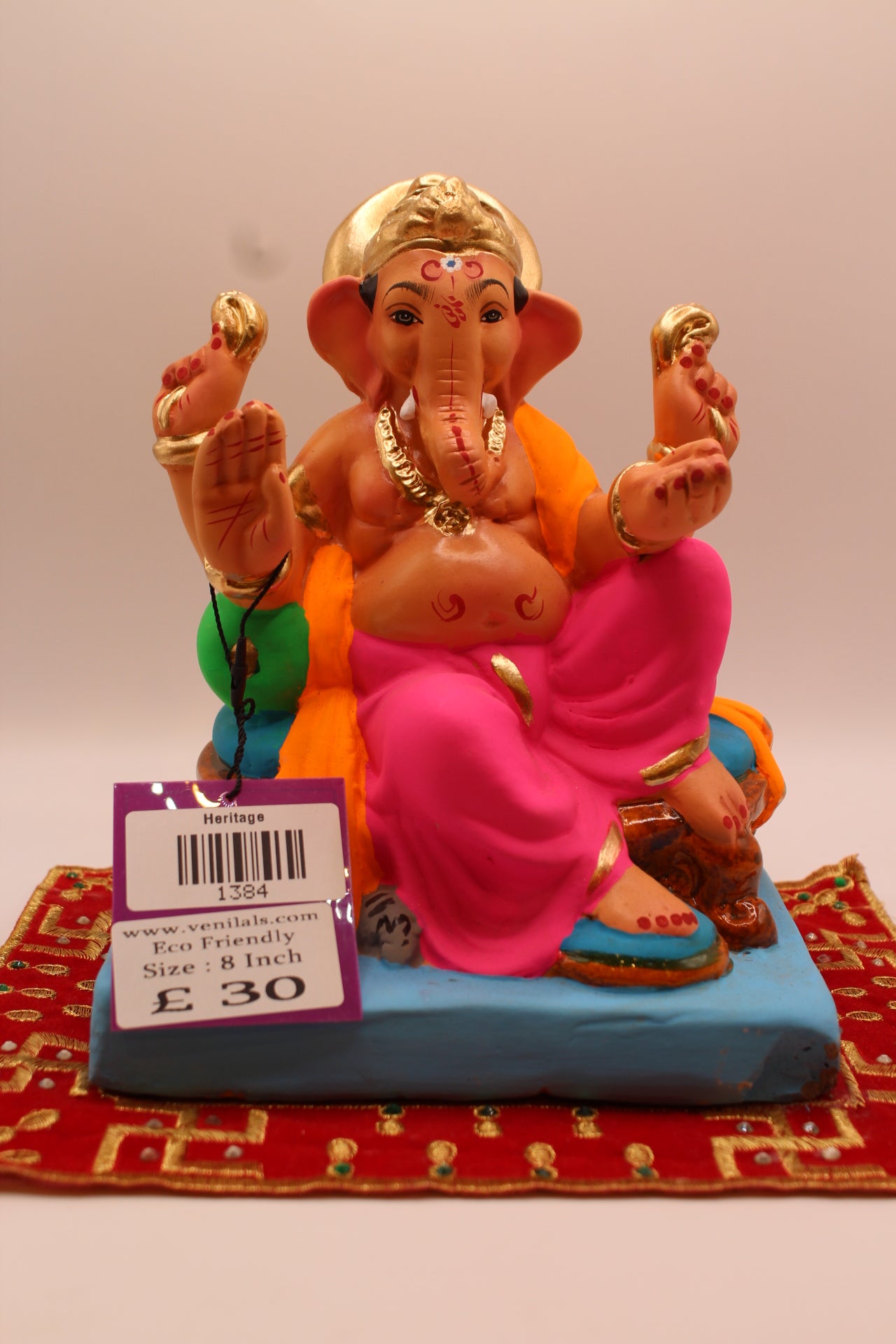 8 inch eco-friendly Ganesh idol – orange khes and pink dhoti with raised knee, front
