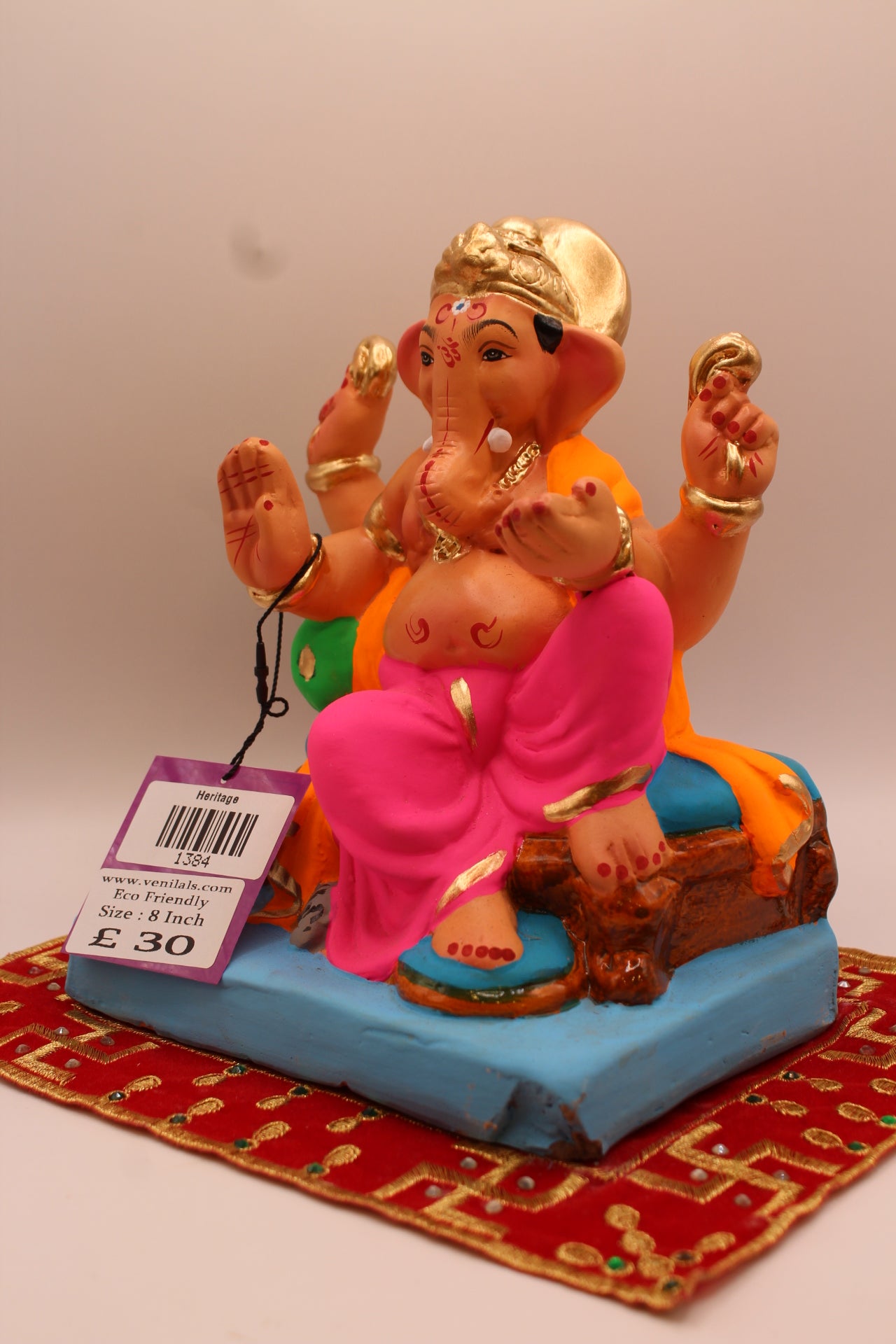 Angled view – orange khes and pink dhoti with raised knee