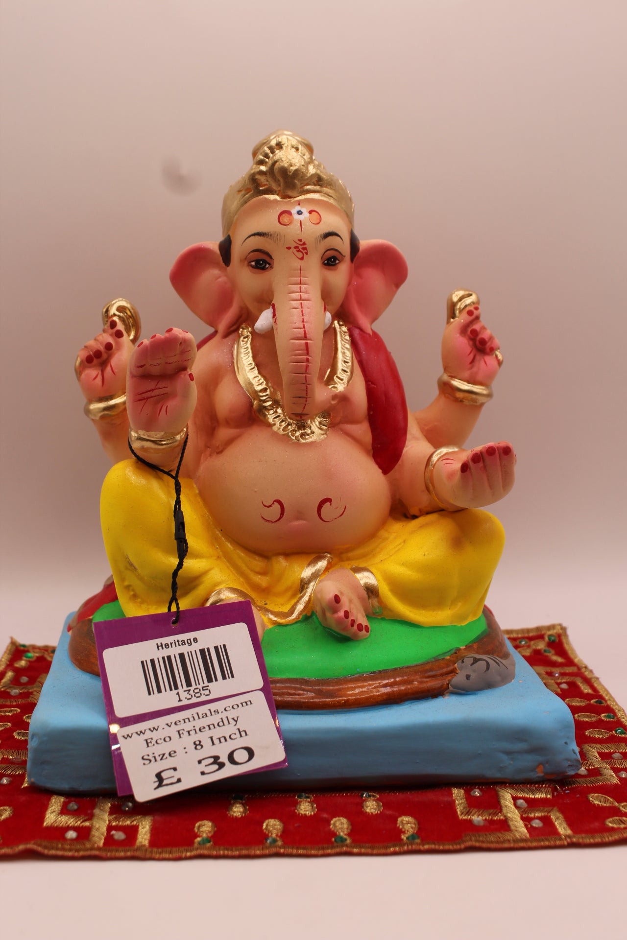 8 inch eco-friendly Ganesh idol – red khes trailing down the back over a yellow dhoti, front