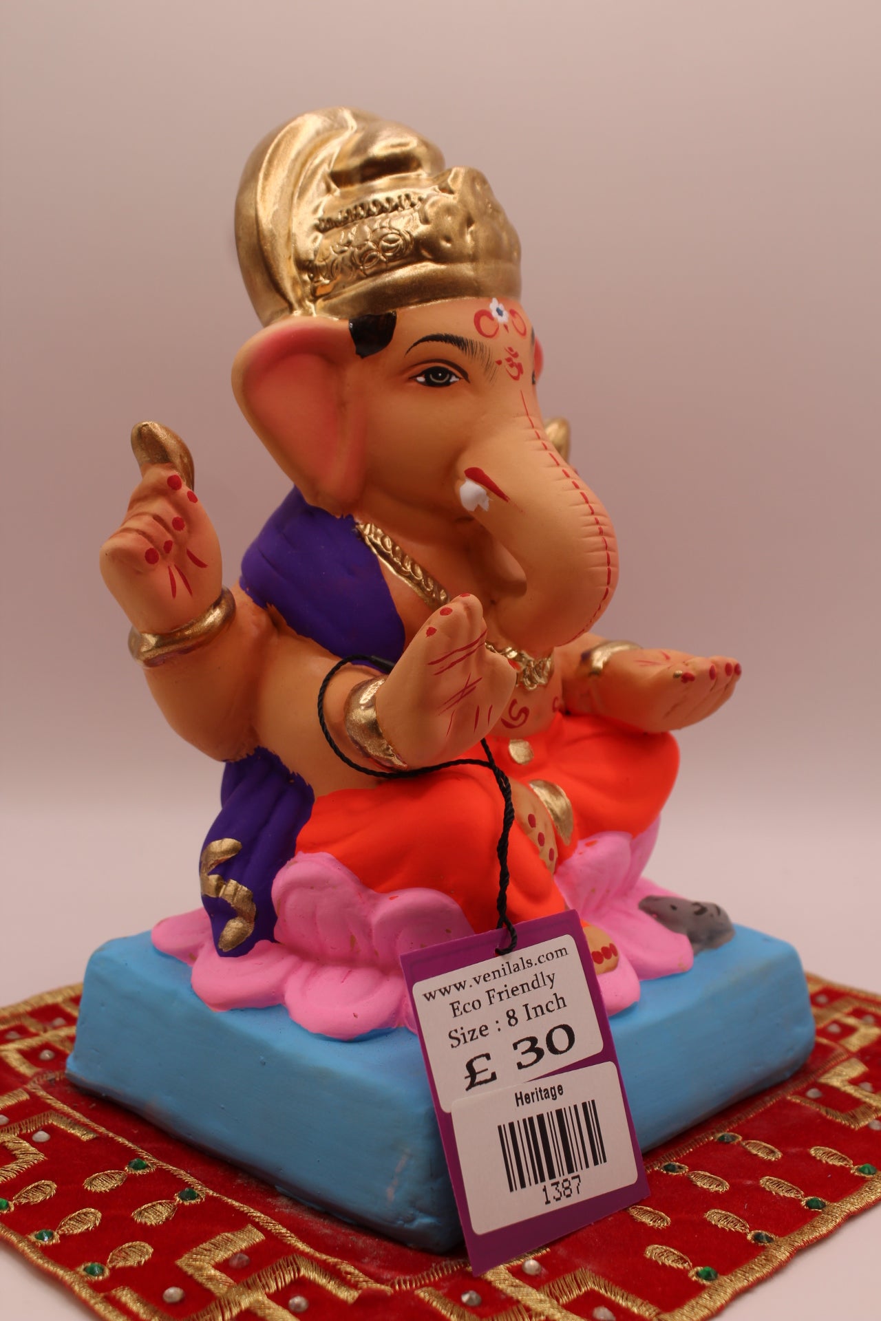Side view – purple khes and orange dhoti on a pink lotus base