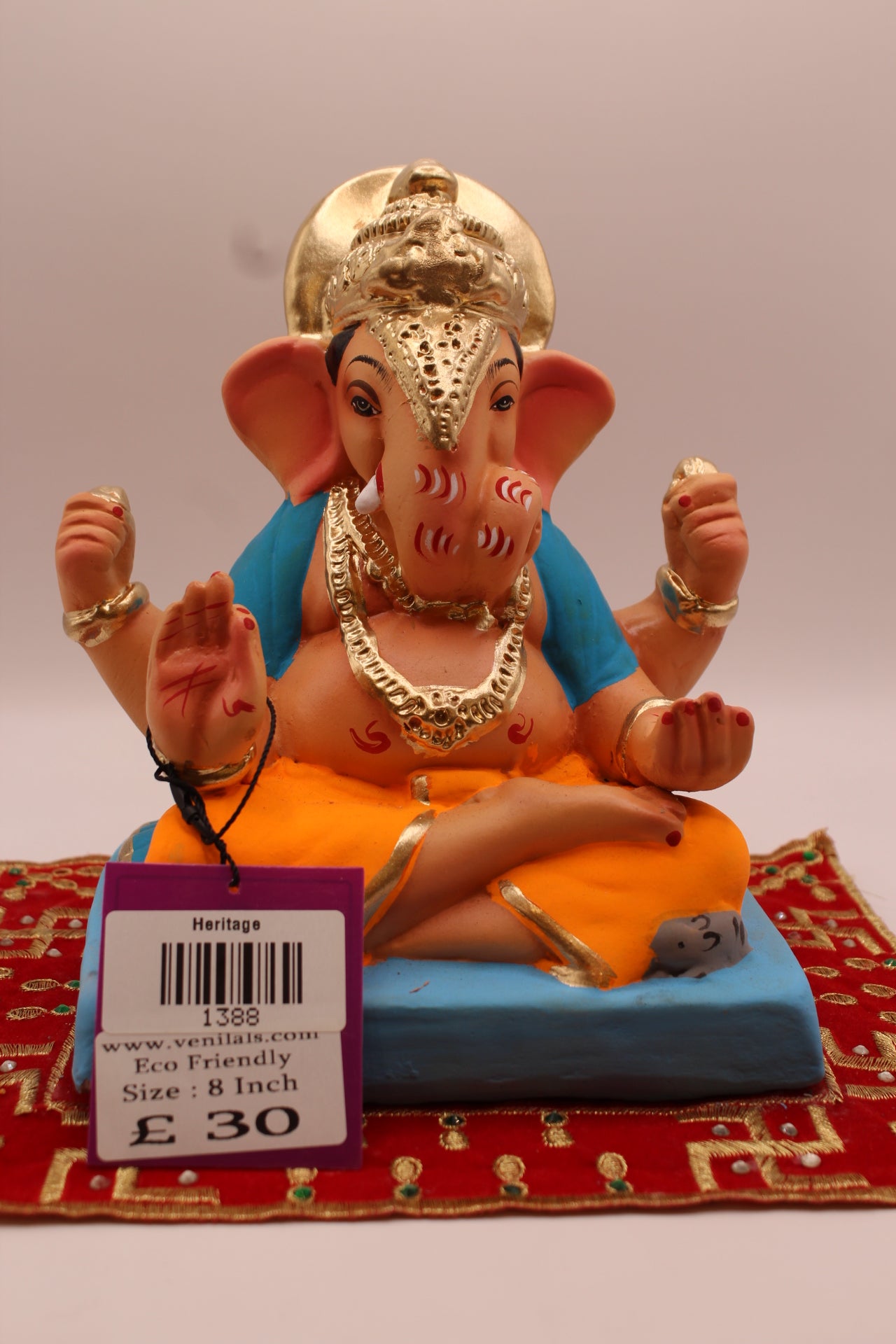 8 inch eco-friendly Ganesh idol – sky blue khes and orange dhoti with halo crown, front