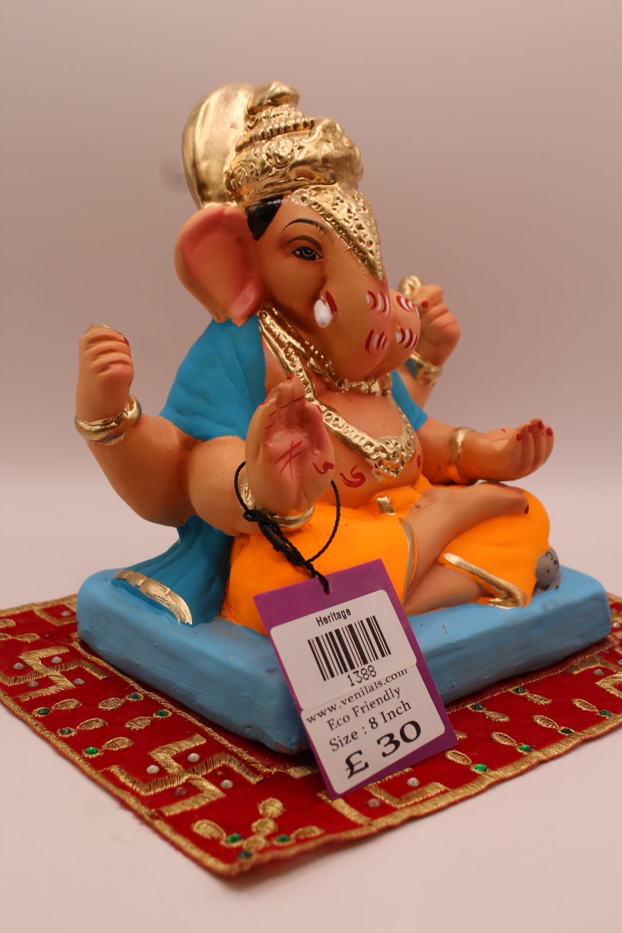 Side view – sky blue khes and orange dhoti with halo crown