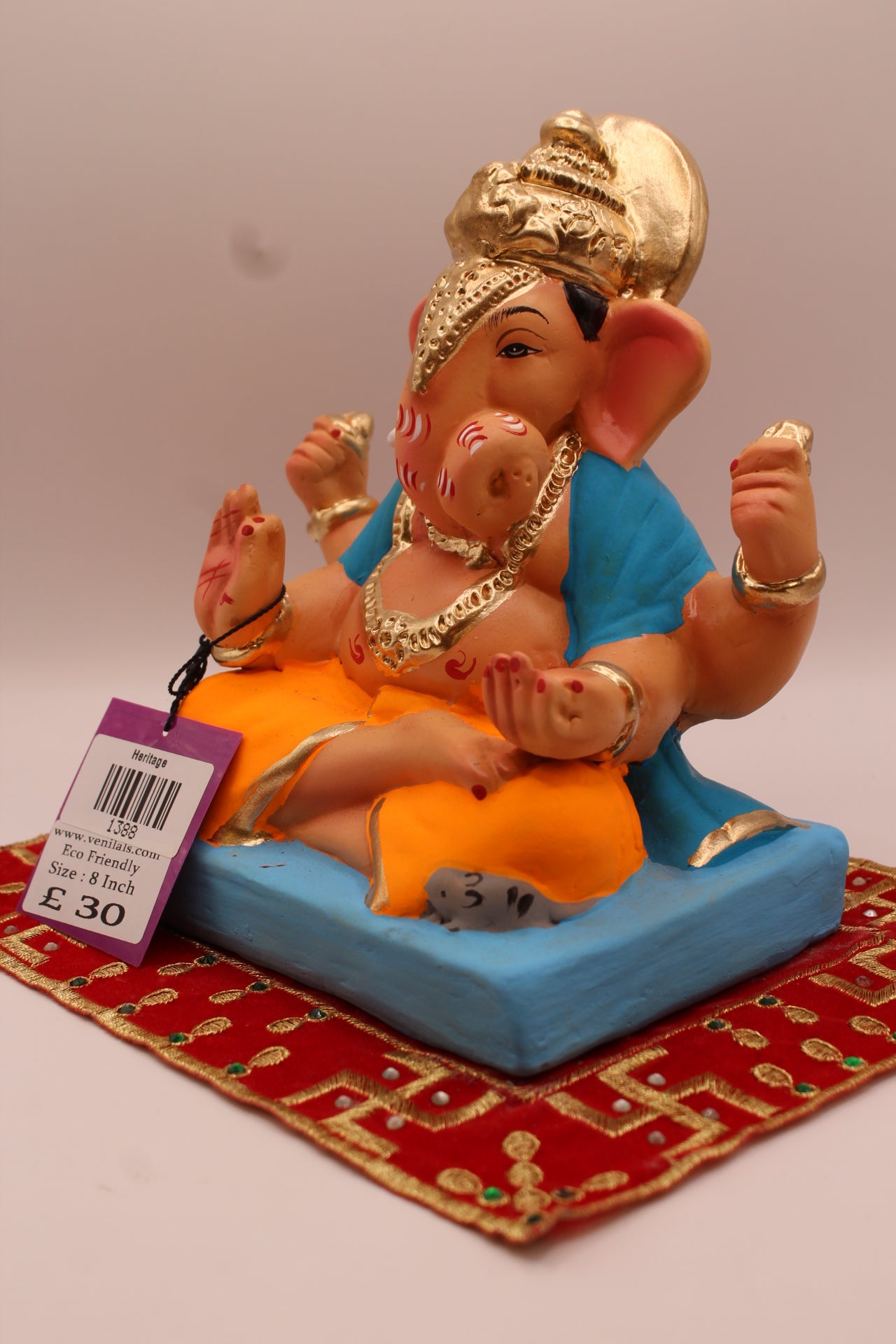 Angled view – sky blue khes and orange dhoti with halo crown