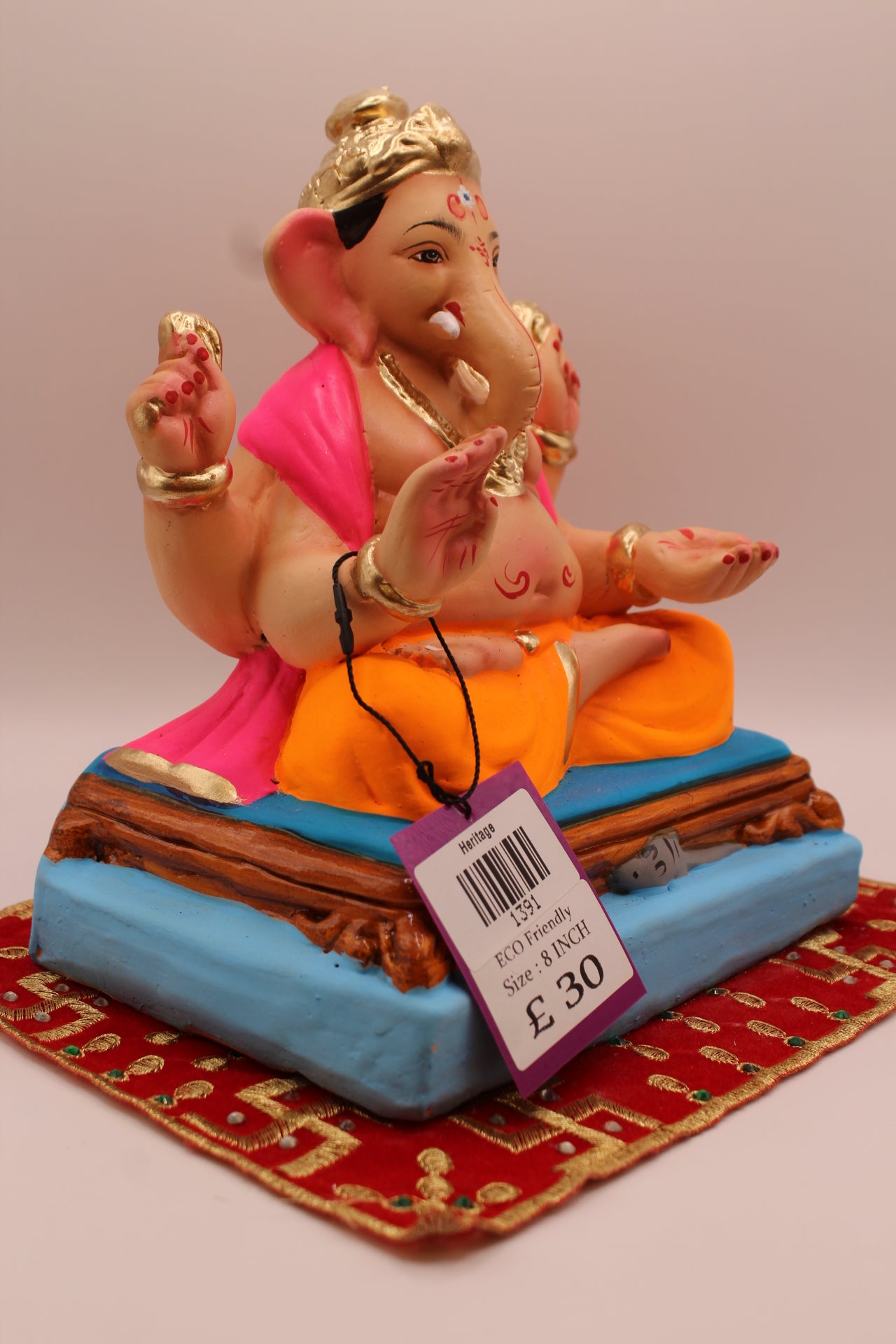 Side view – rani pink khes and orange dhoti on a purple mat