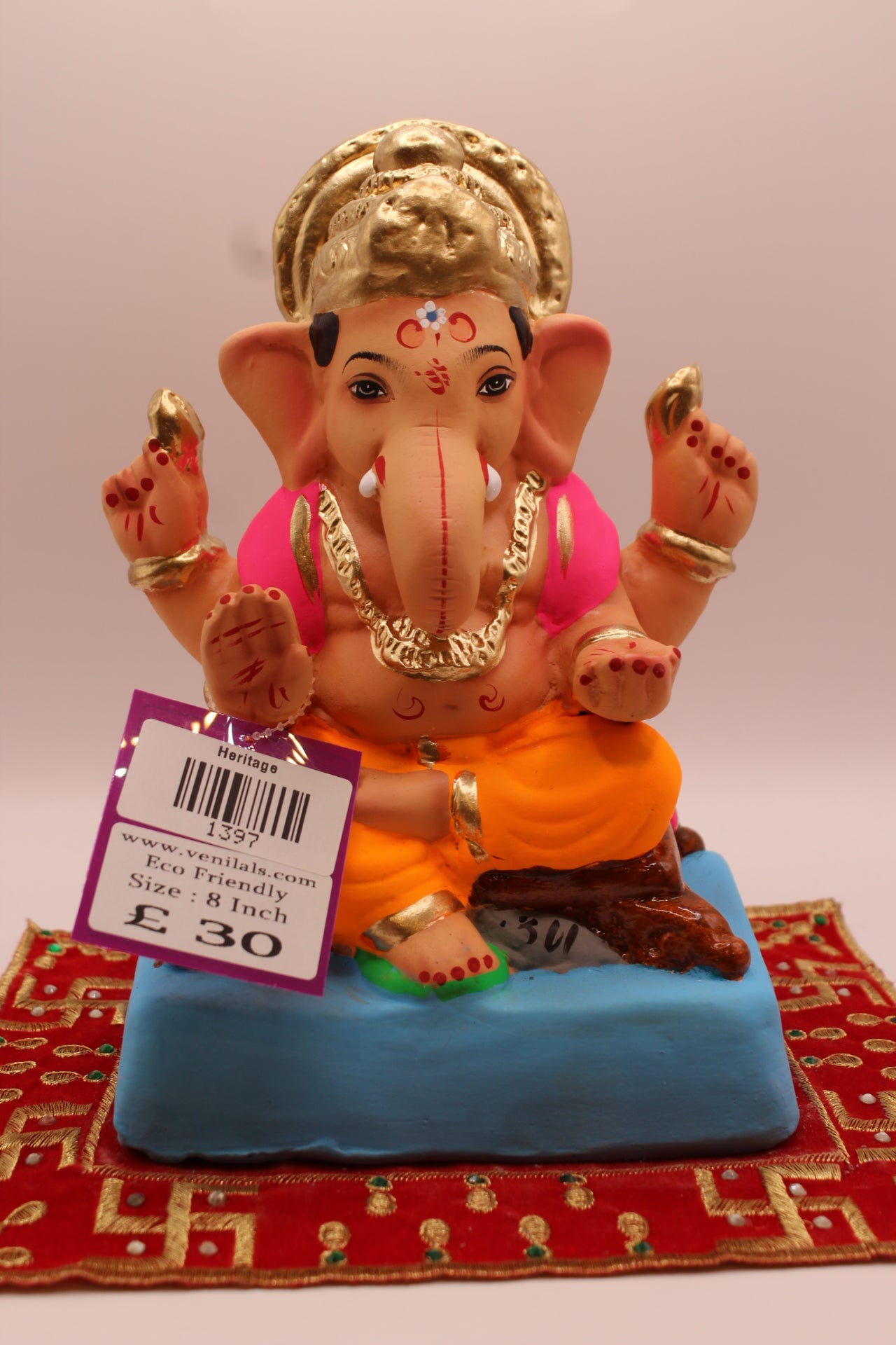 8 inch eco-friendly Ganesh idol – pink khes and orange dhoti with gold halo crown, front