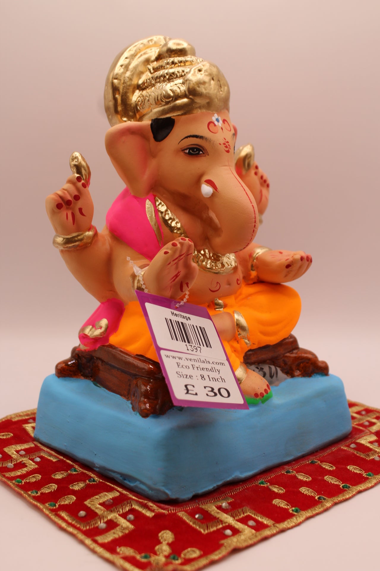 Side view – pink khes and orange dhoti with gold halo crown