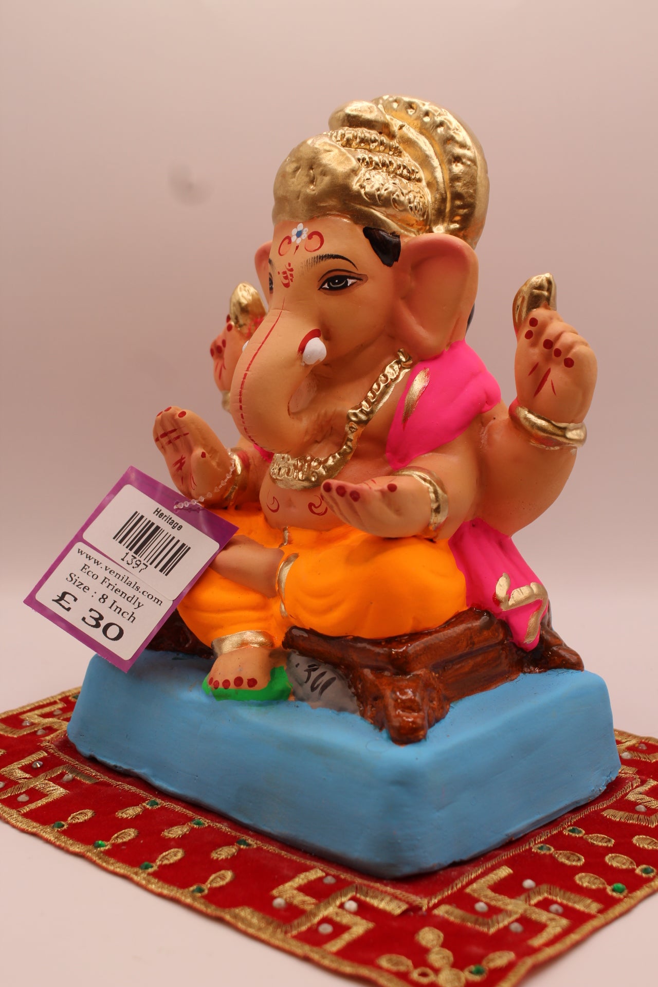 Angled view – pink khes and orange dhoti with gold halo crown