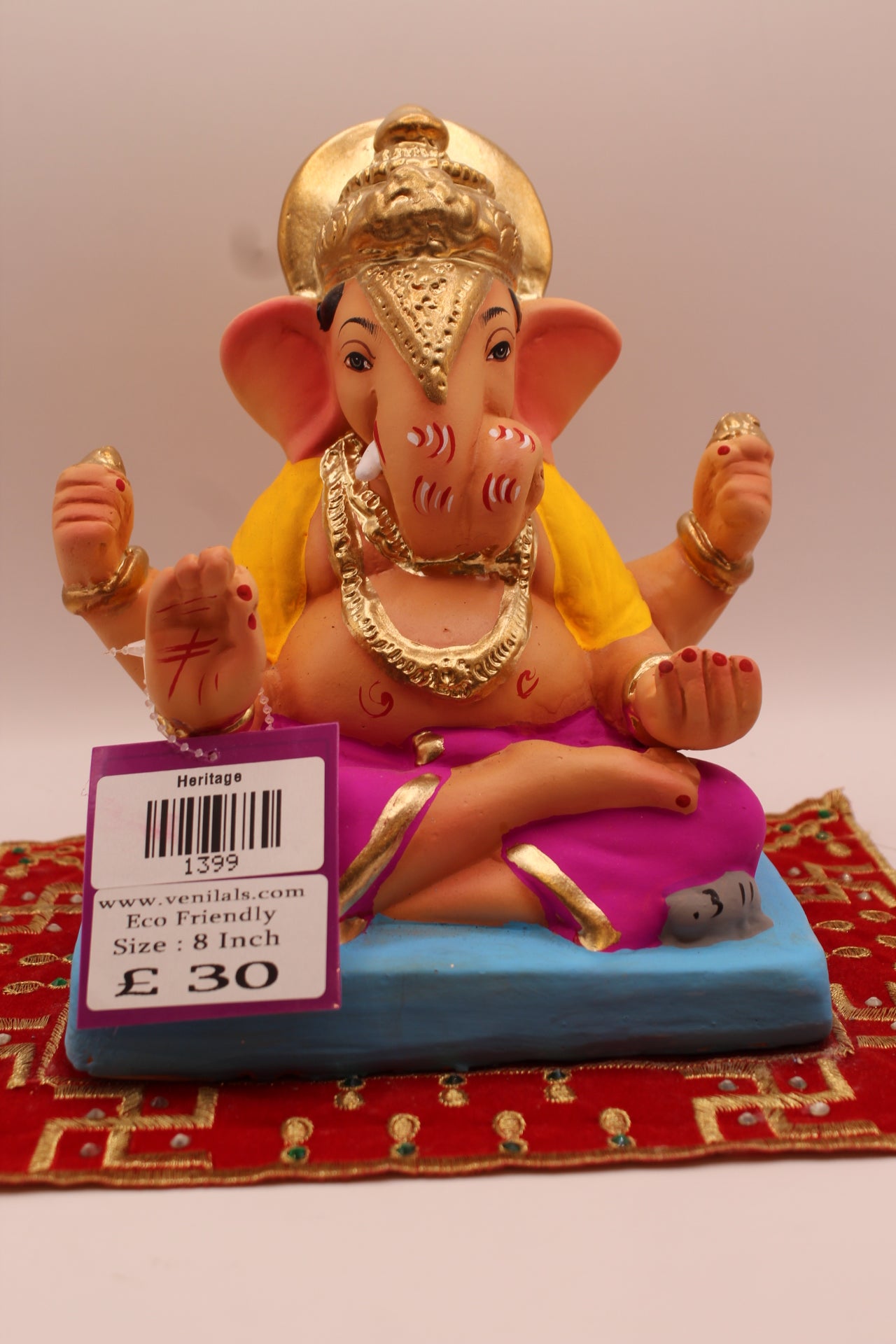 8 inch eco-friendly Ganesh idol – yellow khes and magenta dhoti in leaning pose, front